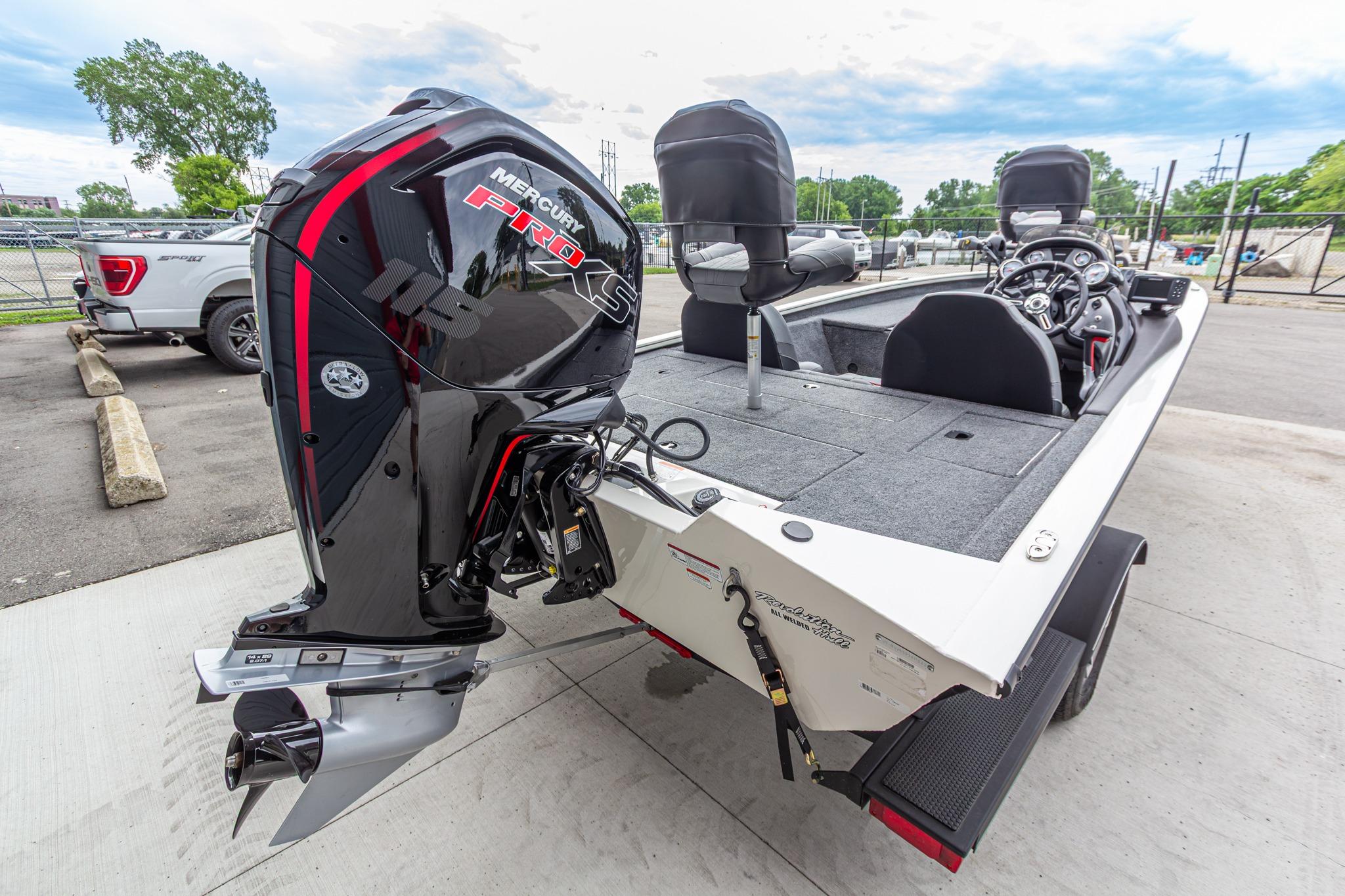 2023 Tracker Pro Team 190 TX boat with Mercury Pro XS engine, parked outdoors.