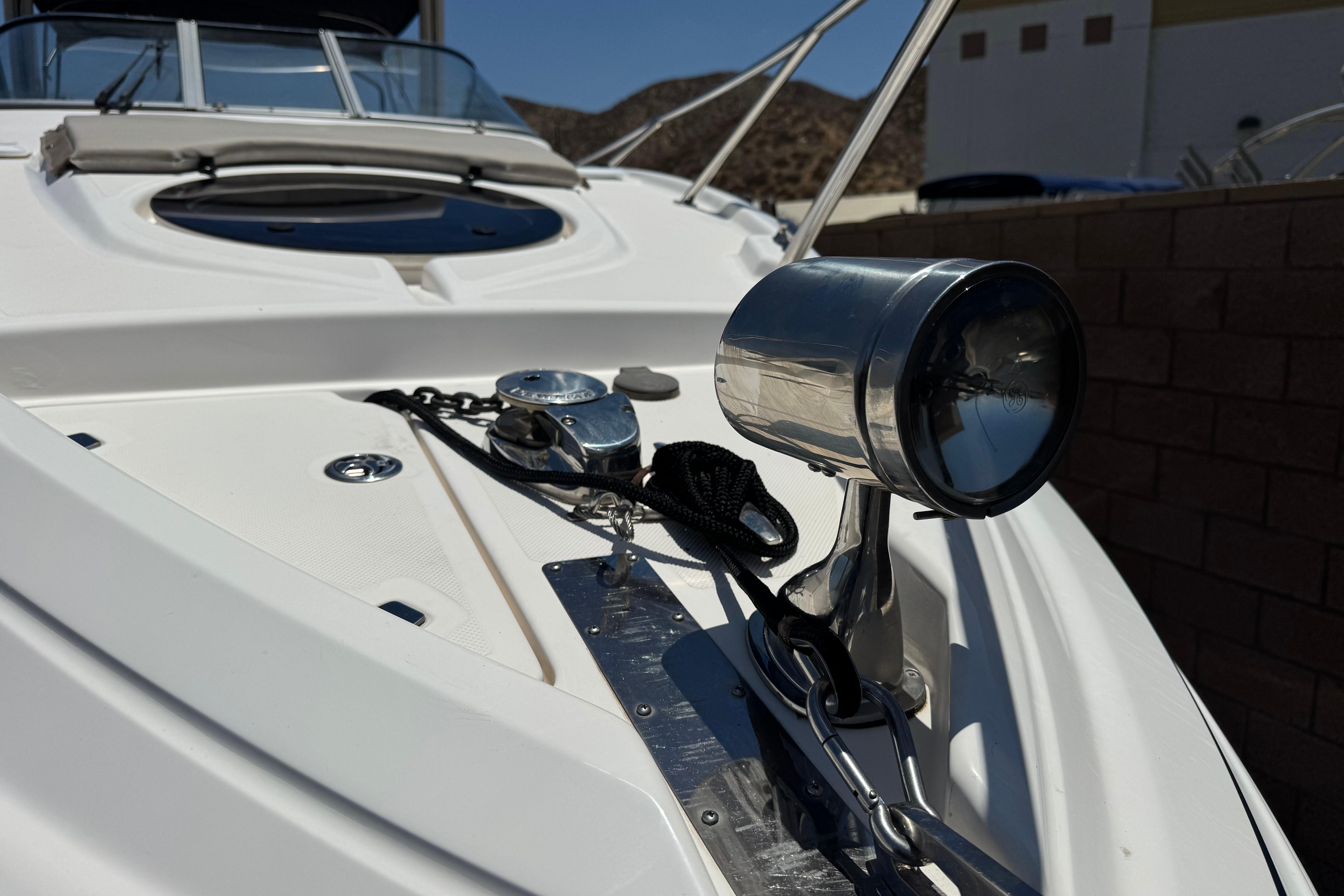 2013 Regal 28 Express boat deck with spotlight and anchor chain.