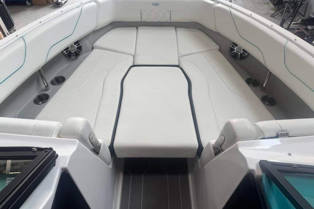 2022 Regal LS6 Surf boat interior with white seating and cup holders.