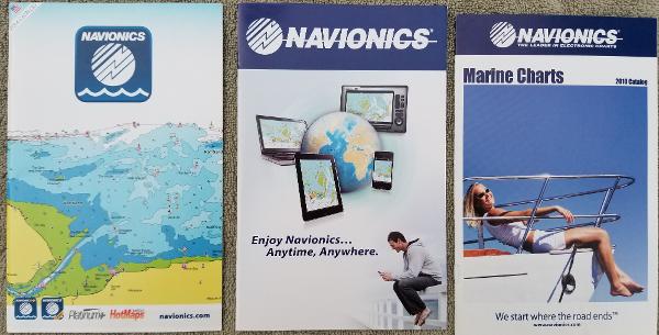 Navionics marine charts and technology brochures, featuring maps and devices for navigation.