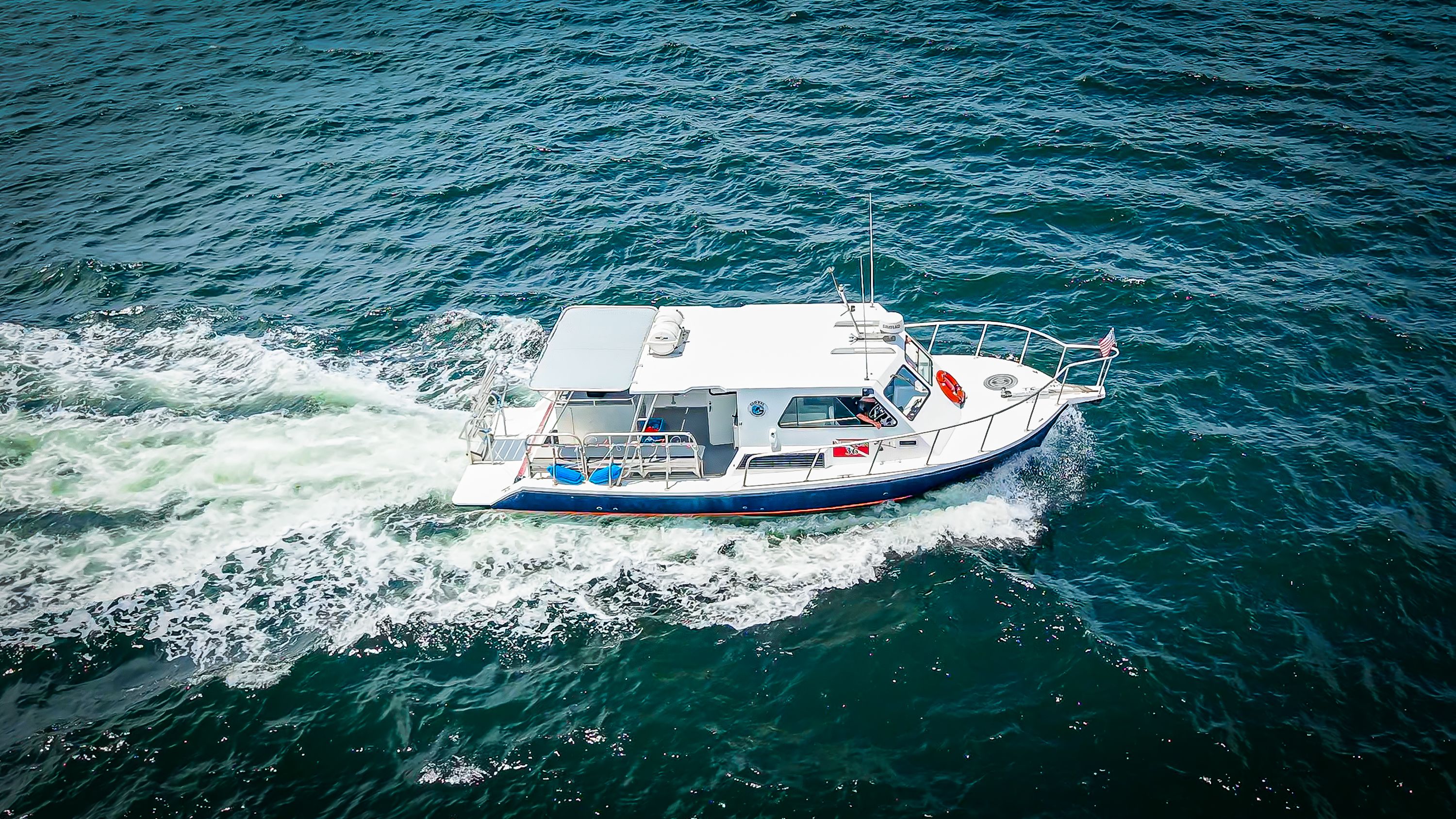 A 2019 Newton 36' Dive Special boat cruising on the open sea.