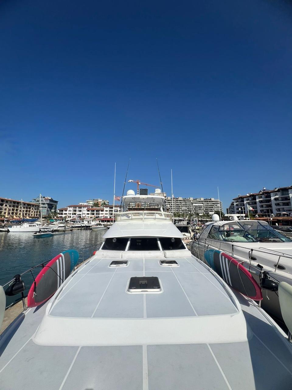 1995 Mikelson 60 Sportfisher docked under clear blue sky.