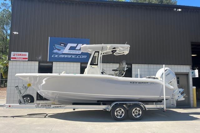2026 Key West 239 FS boat on trailer outside CIC Marine dealership.