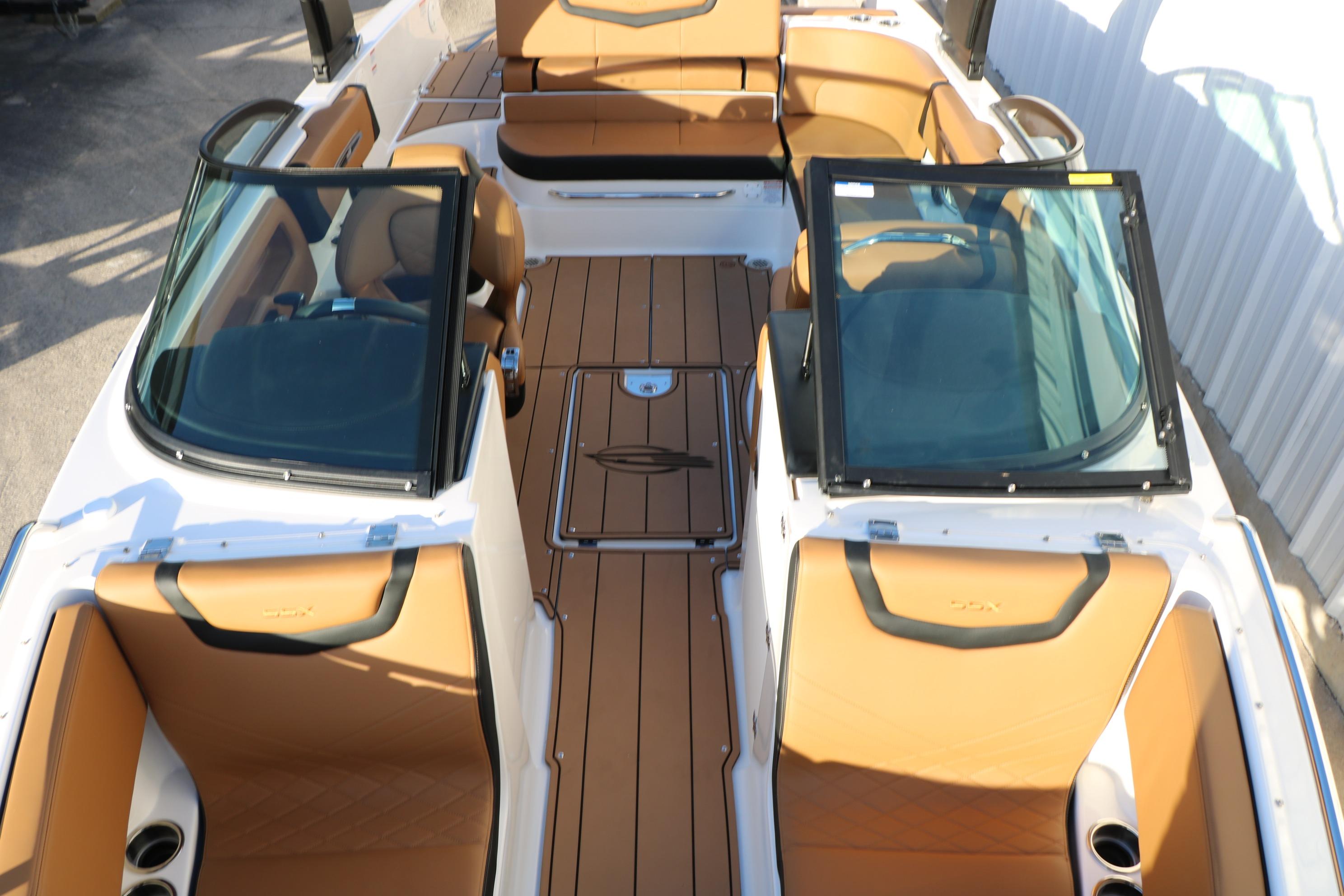 2026 Chaparral 247 SSX boat interior with tan seating and sleek design.