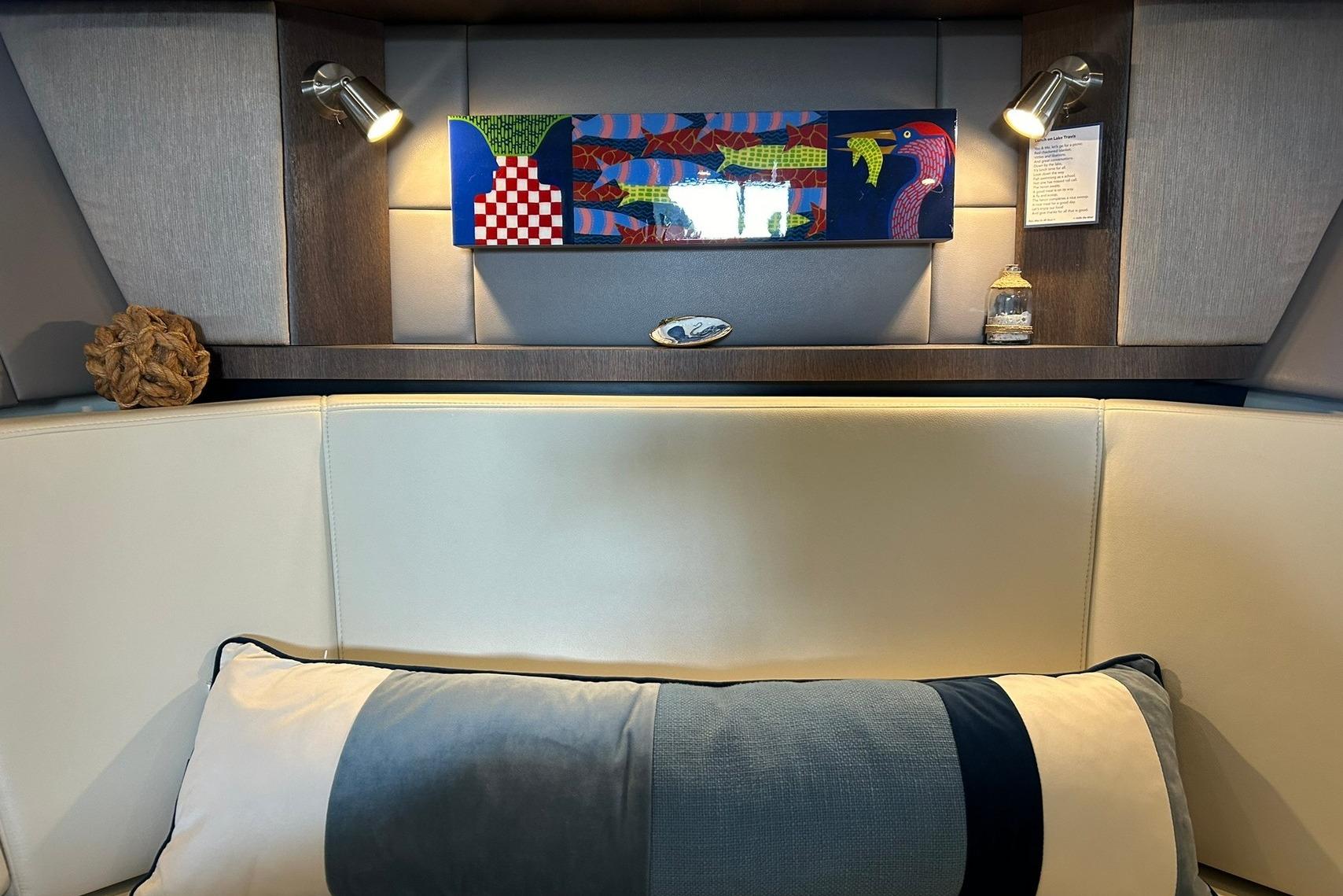 Luxurious interior of 2017 Monterey 360 Sport Coupe with modern art and ambient lighting.