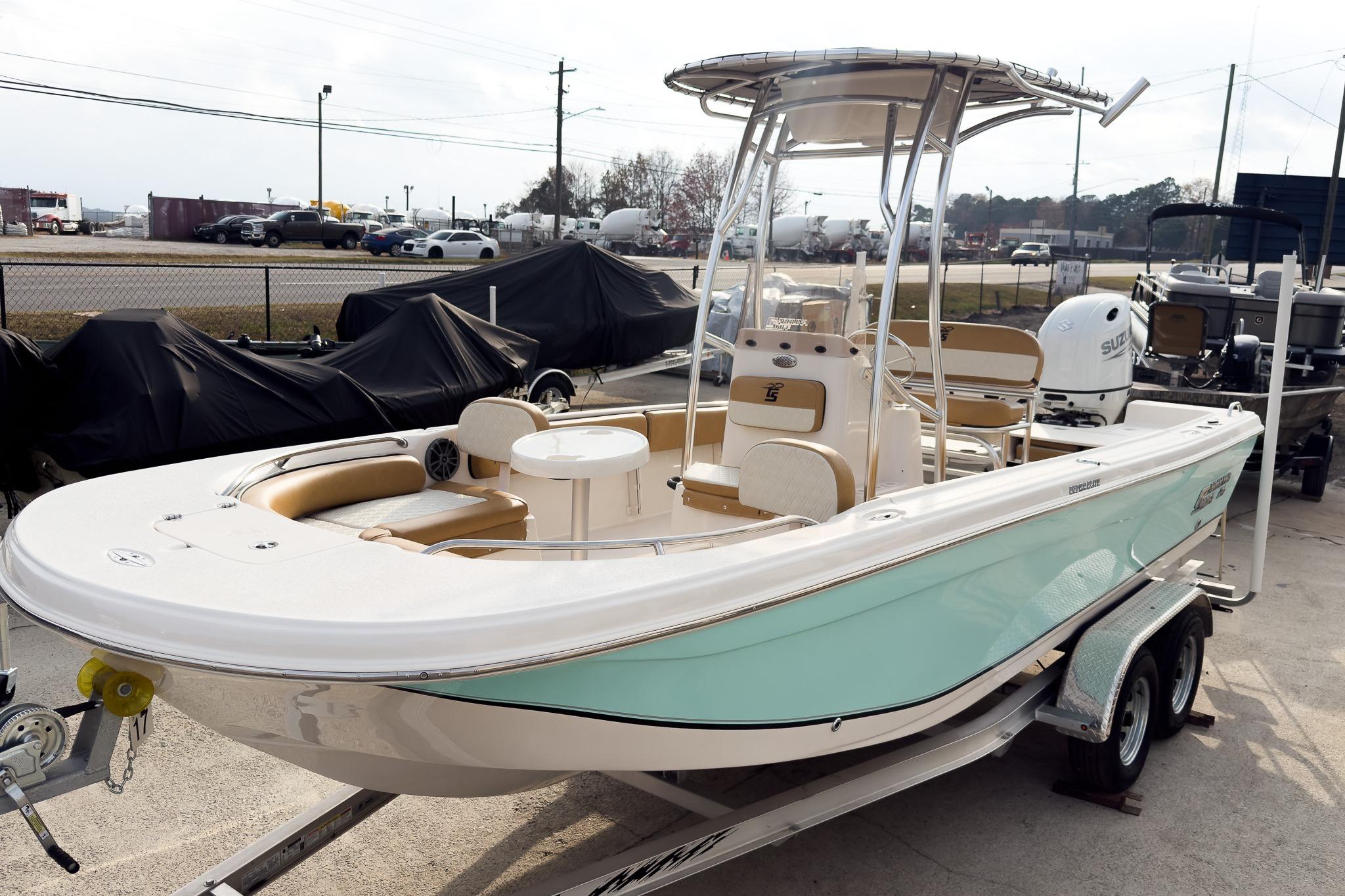 2025 Carolina Skiff 21 Ultra Elite boat on trailer, featuring sleek design and modern amenities.