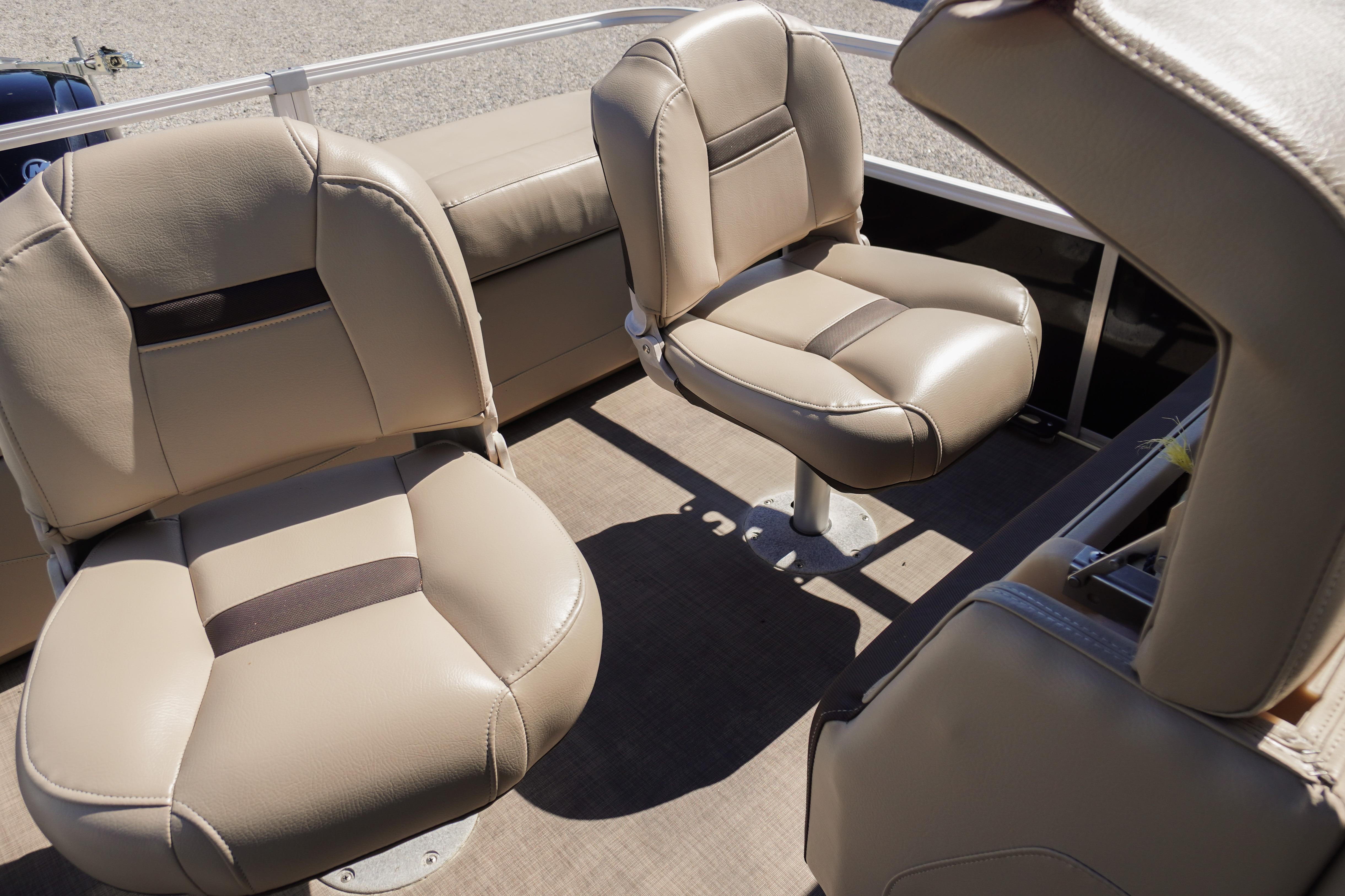 2019 SUNTRACKER Fishin' Barge 22 DLX interior with beige seating arrangement.