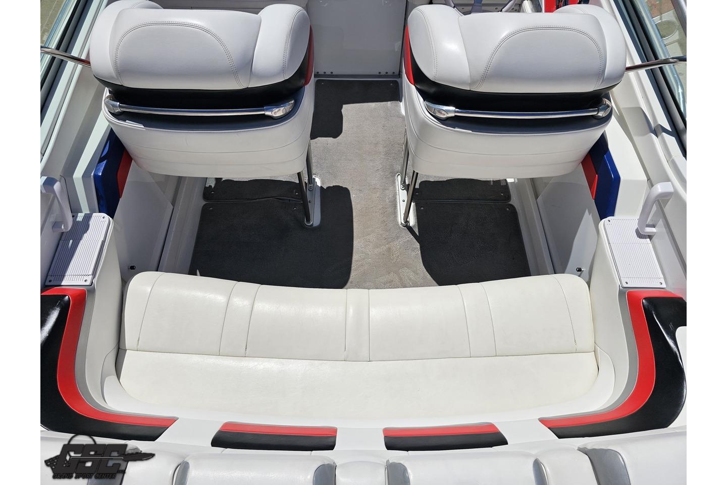 Interior of a 2005 Formula 271 FASTech boat with white and red seating.