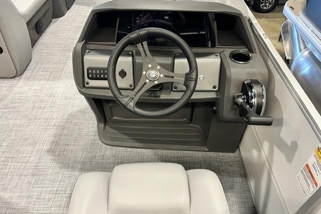 2026 Sun Tracker Party Barge 20 DLX steering console with modern controls and seating.