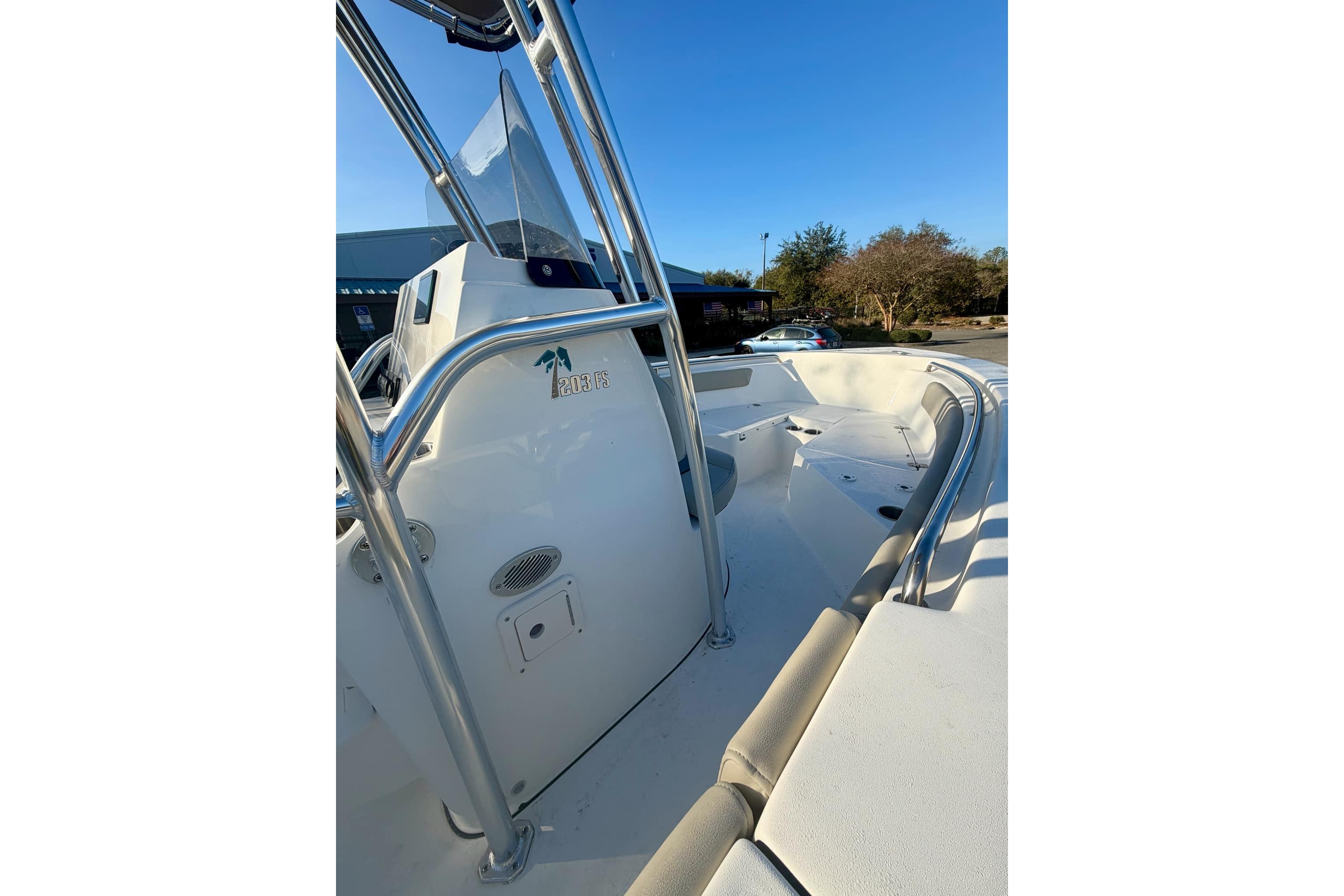 2026 Key West 203 FS boat interior with stainless steel railings and seating.
