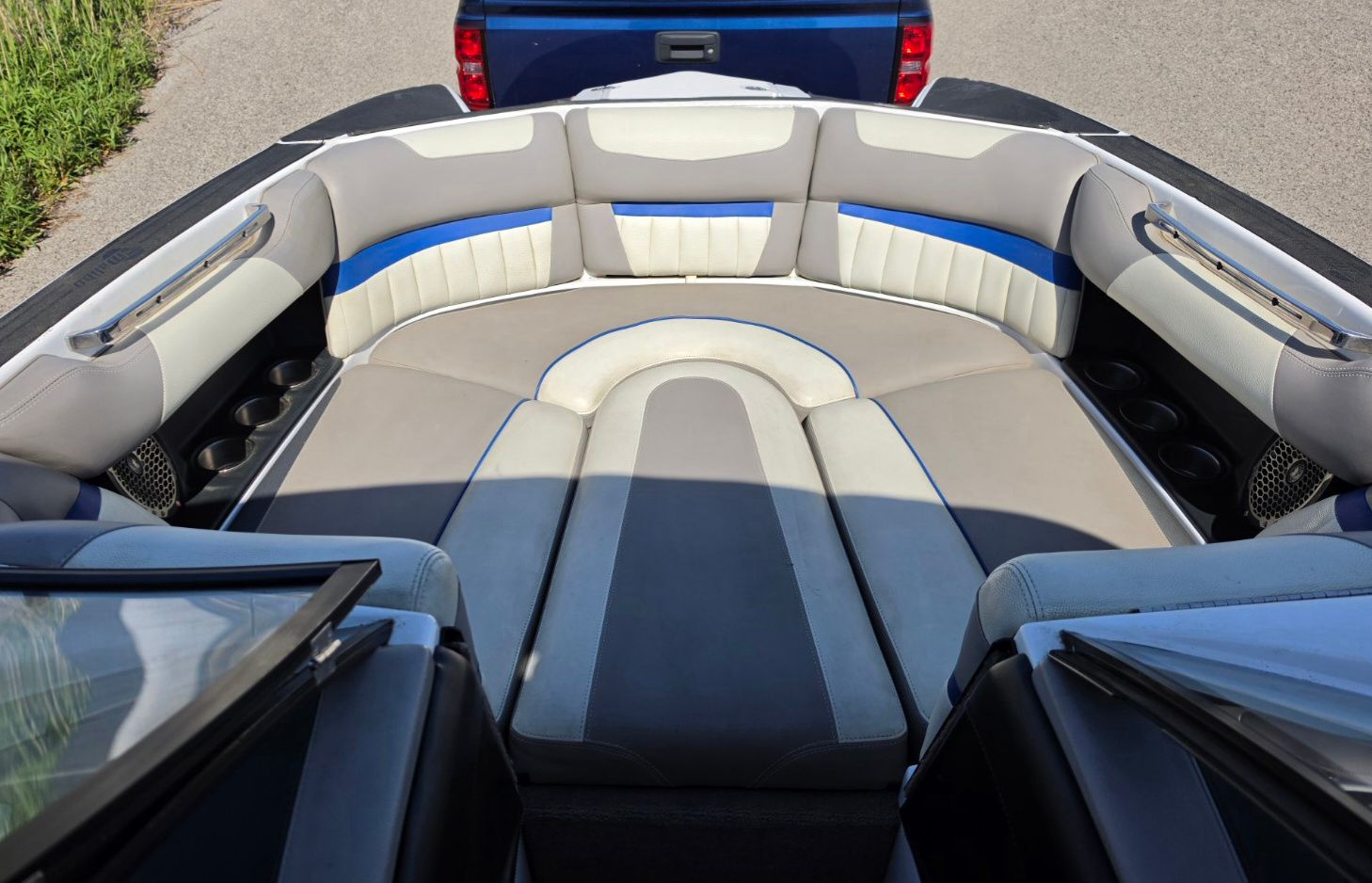 Interior of 2014 Malibu Wakesetter 24 MXZ boat with gray and blue seating.