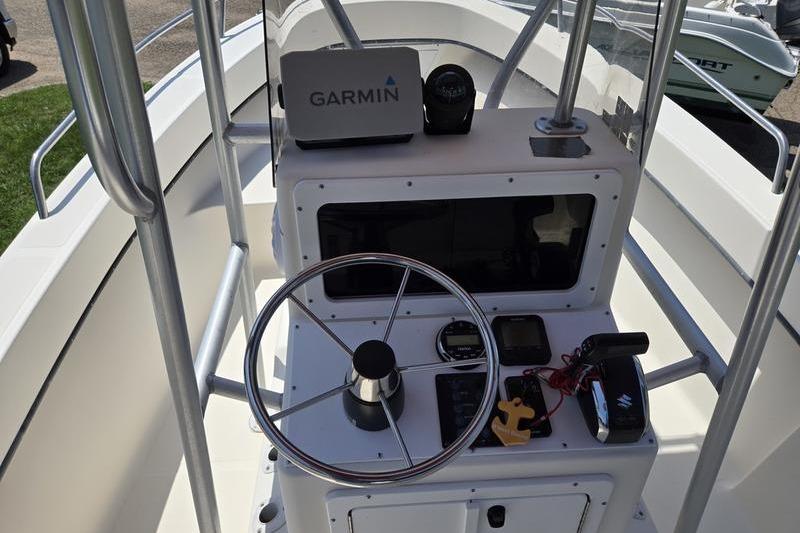 Center console of a 2000 May-Craft 2000CC boat with Garmin navigation system.