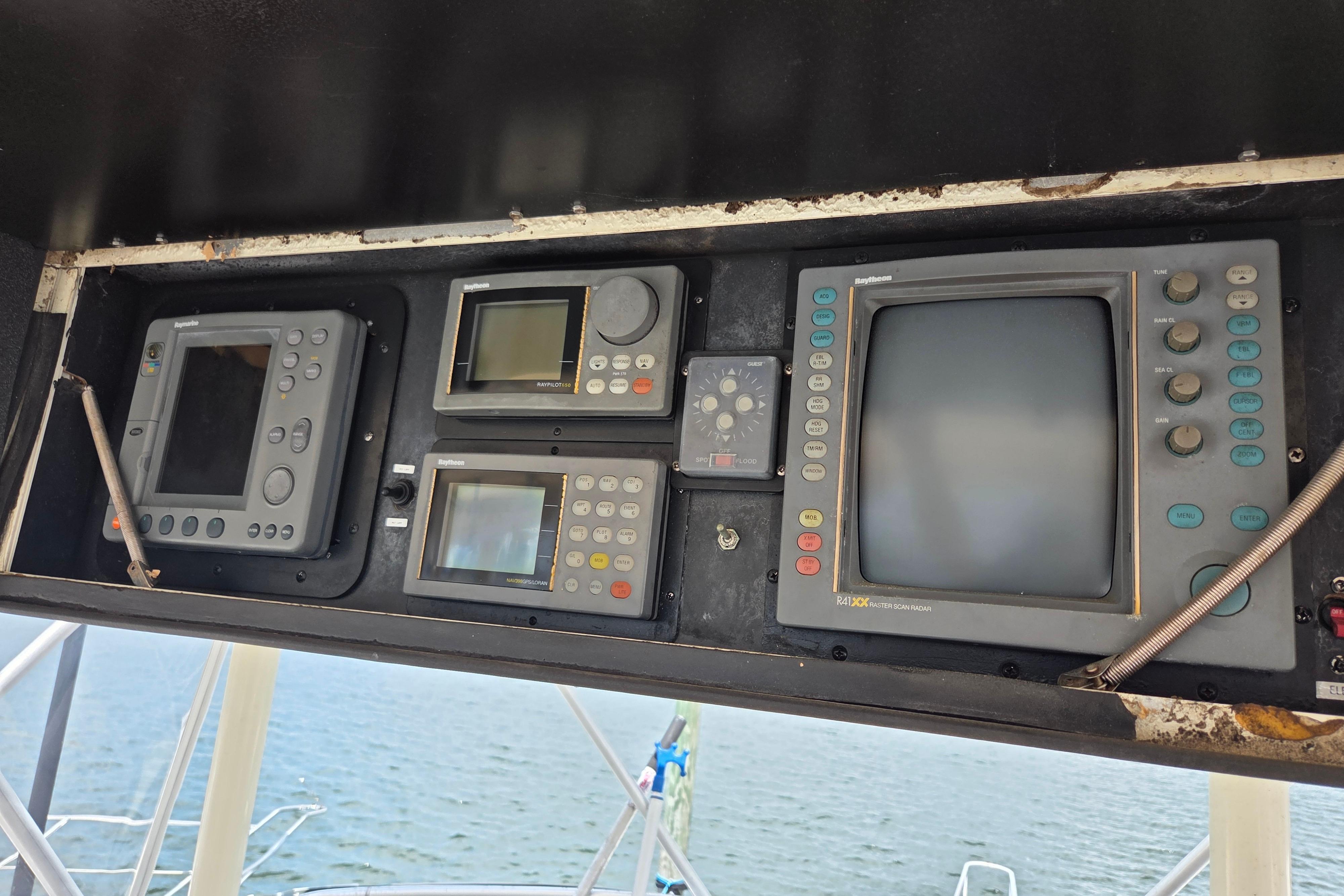 Control panel of a 1990 Egg Harbor Golden Egg 42 boat with navigation equipment.