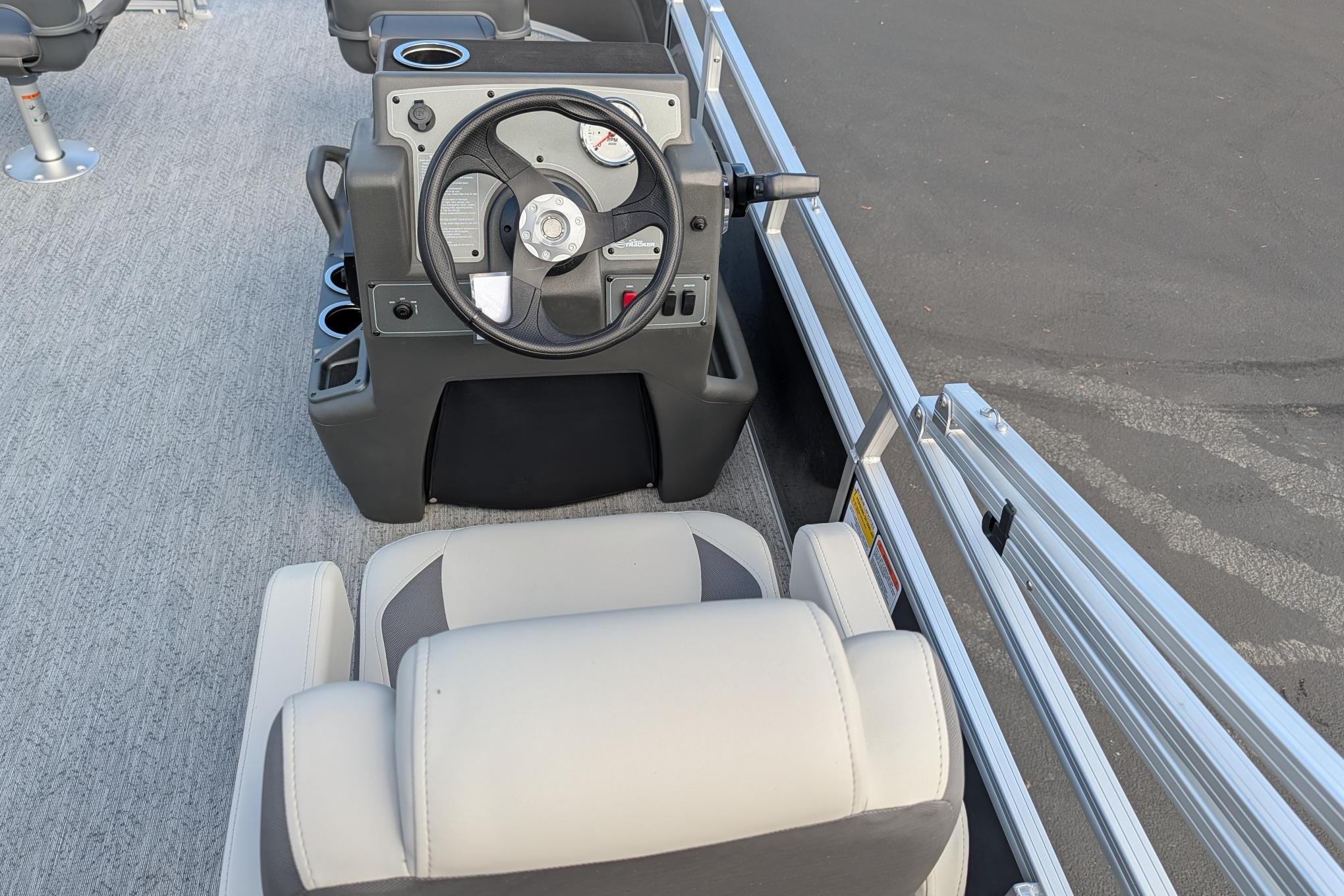 2026 Sun Tracker Bass Buggy 16 XL Select boat interior with steering console and seating.