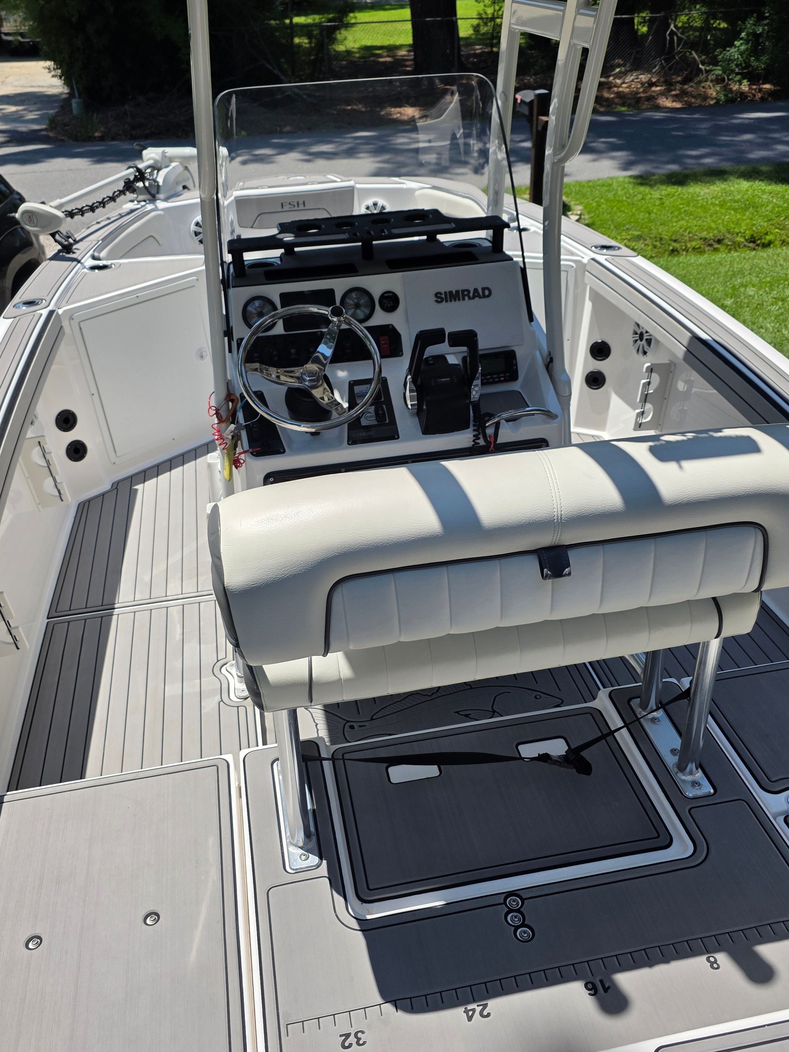 Interior view of a 2020 Yamaha 210 FSH Sport boat.