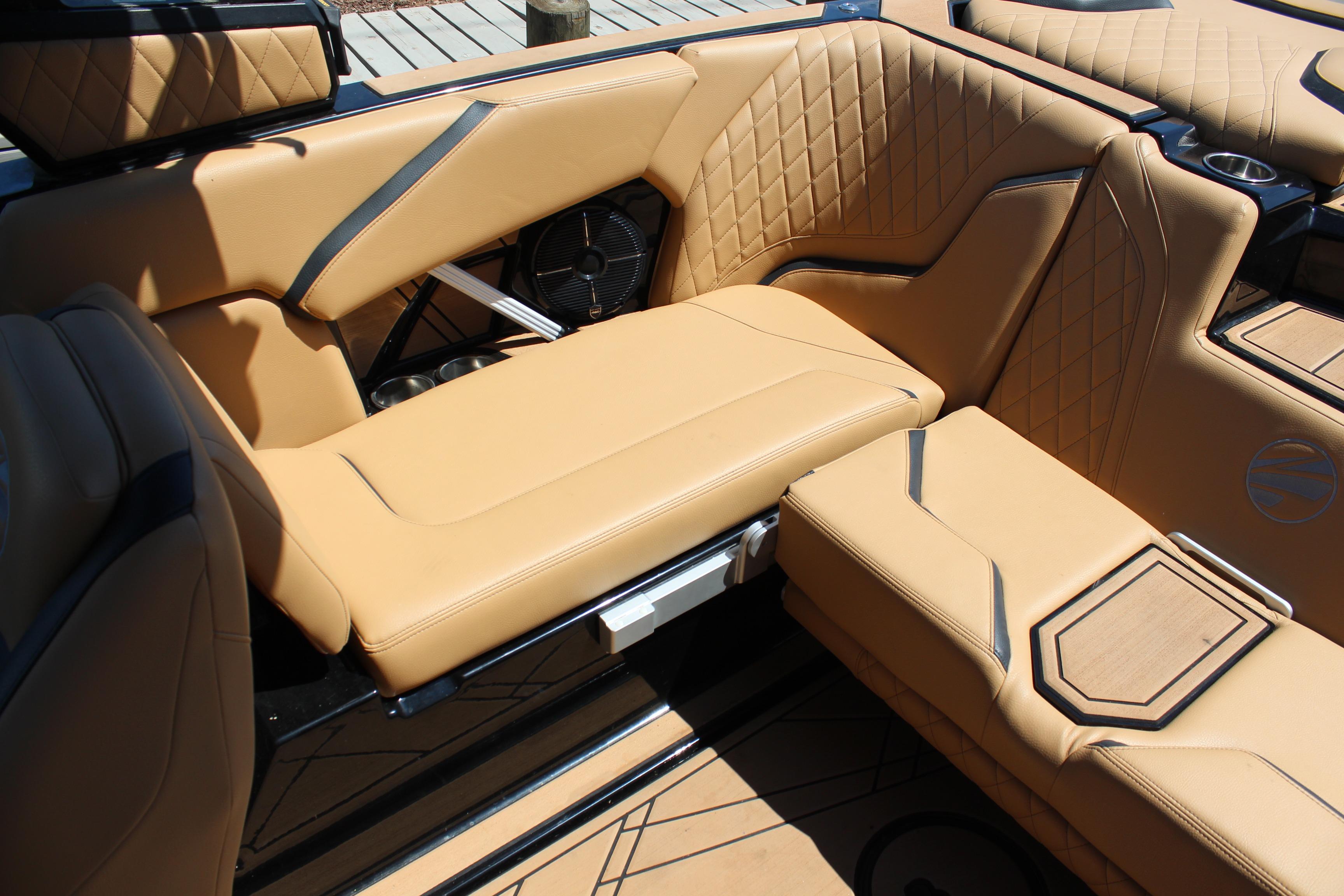 Luxurious interior of 2022 Tigé 22RZX boat with tan leather seating and stylish design.