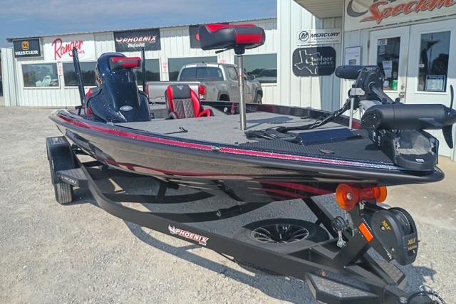 2026 Phoenix 721 ZXL bass boat on trailer, parked outside dealership.