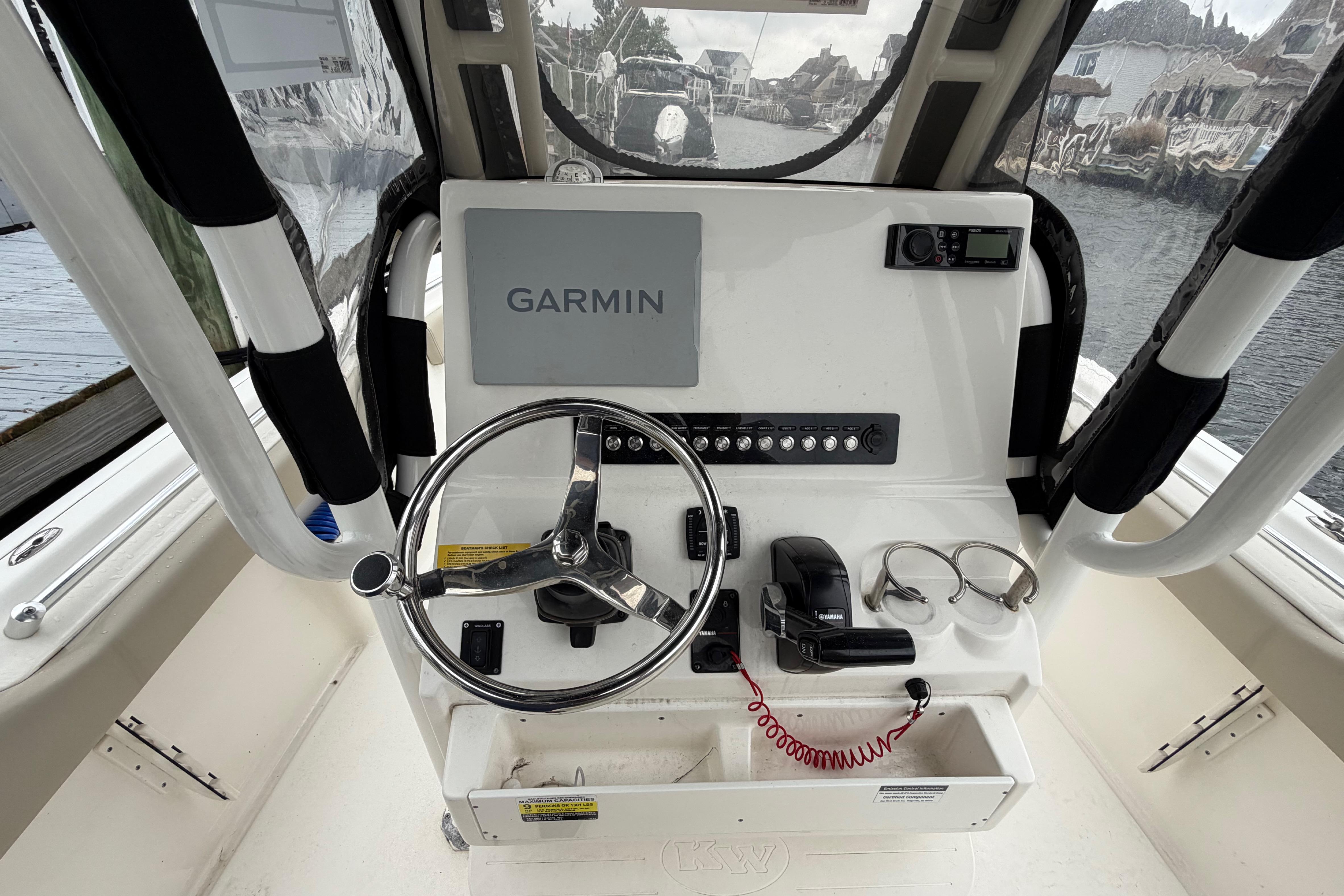 2022 Key West 239 FS boat console with Garmin navigation and steering wheel.