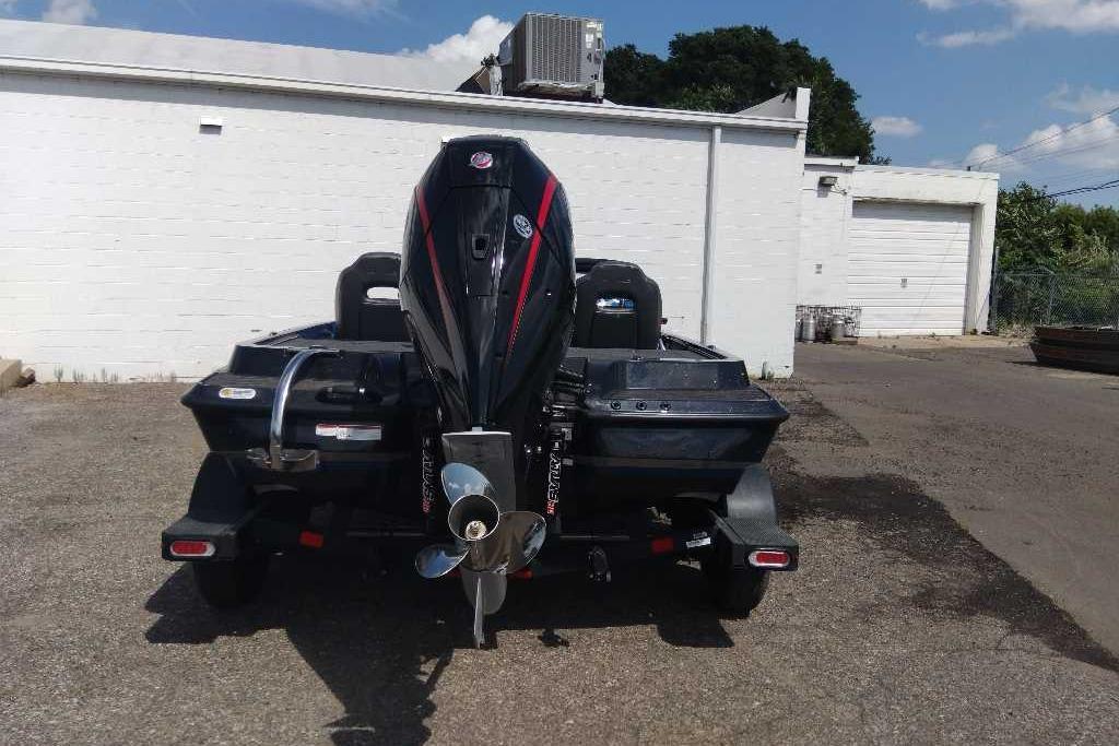 2026 Nitro Z19 XL Pro boat with powerful outboard motor, parked outdoors.