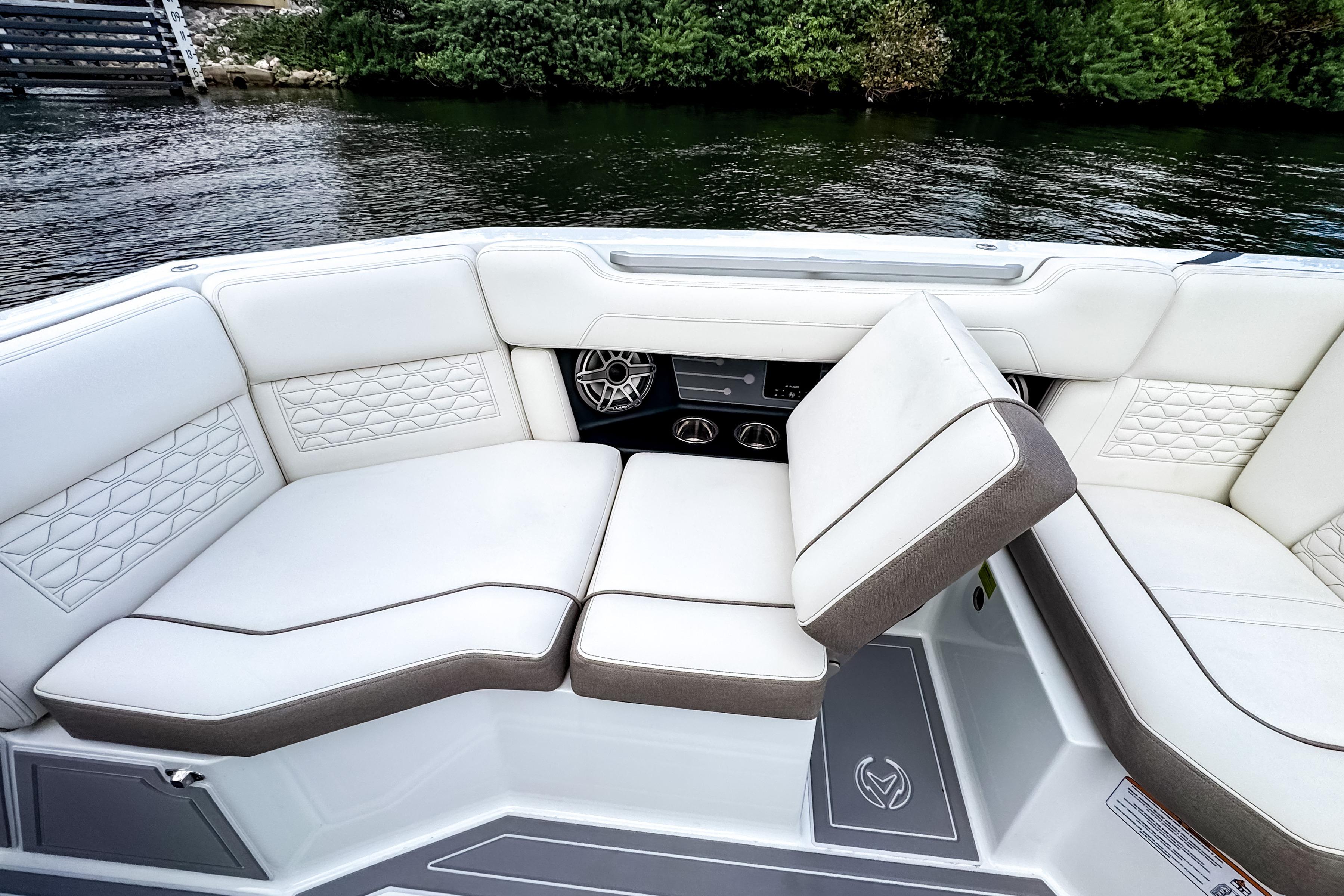 Luxurious seating on 2026 Ingenity EL boat, featuring elegant white upholstery and modern design.