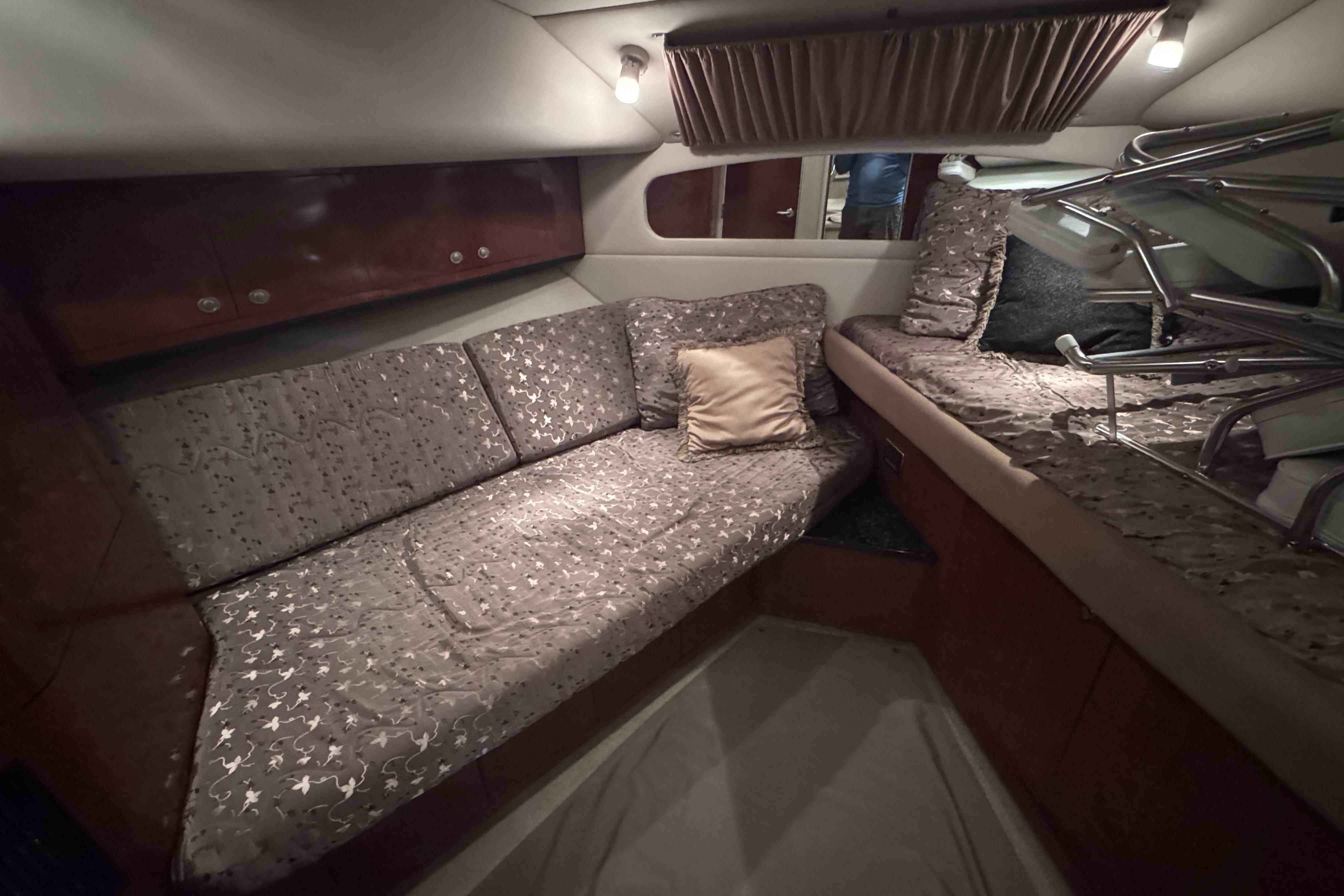 Luxurious interior cabin of 2004 Sea Ray 390 Motor Yacht with cozy seating and elegant decor.