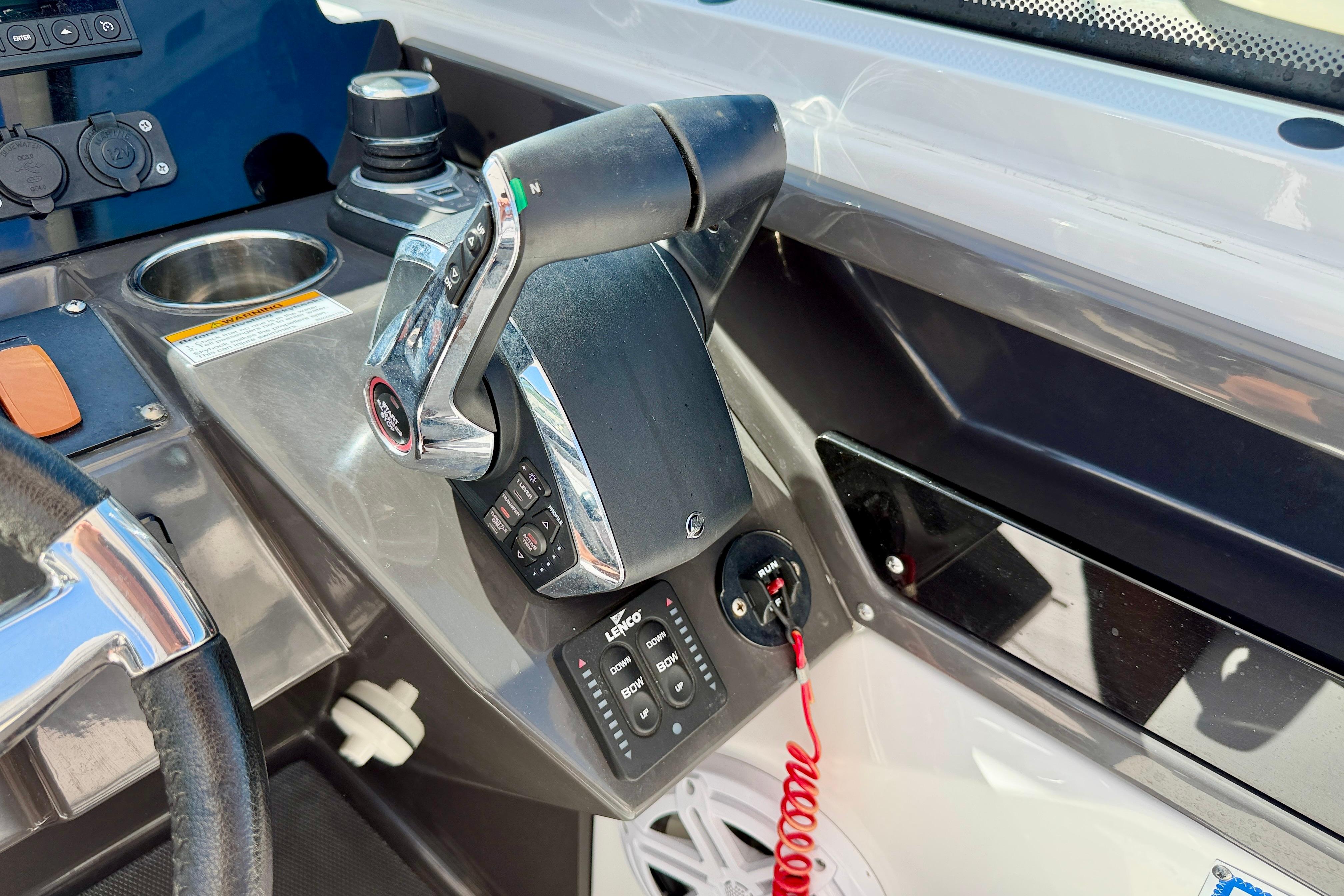 Control panel of 2023 Blackfin 272 DC boat, featuring throttle and steering wheel.