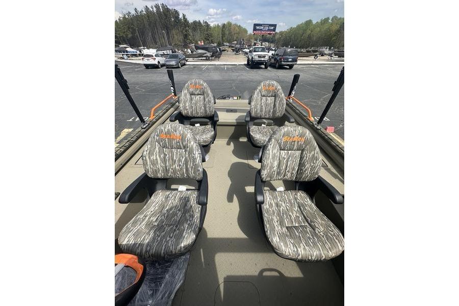 2026 SeaArk EasyCat boat interior with camo-patterned seats in a parking lot.