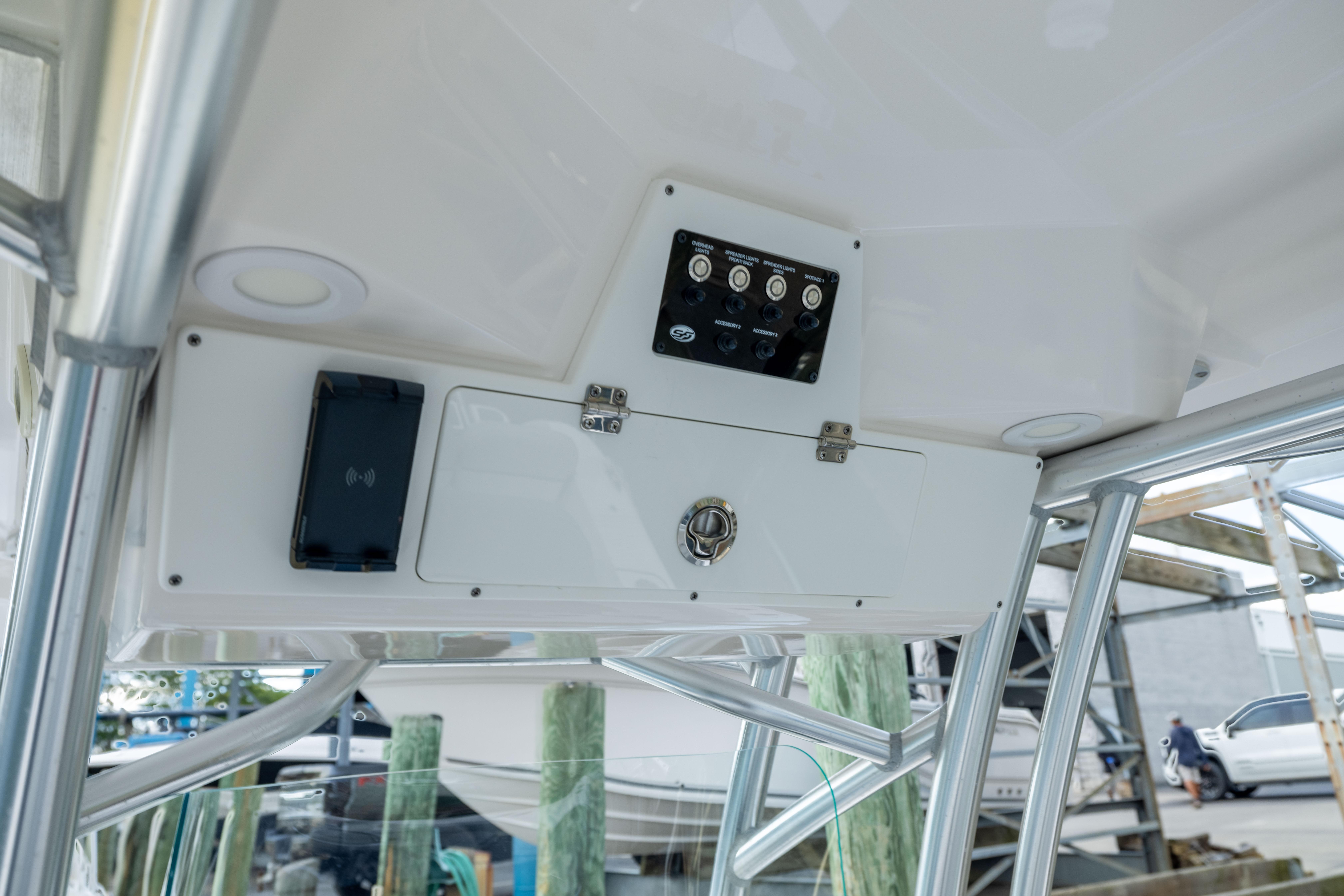 2023 Sea Fox 228 Commander boat console with control panel and storage compartment.