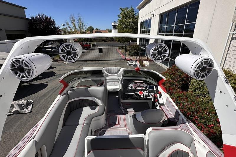 2023 MB SPORTS F22 Tomcat Alpha boat interior with speakers and seating.