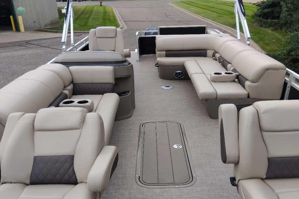 2025 Sun Tracker Sportfish 24 XP3 pontoon boat interior with luxurious seating and cup holders.