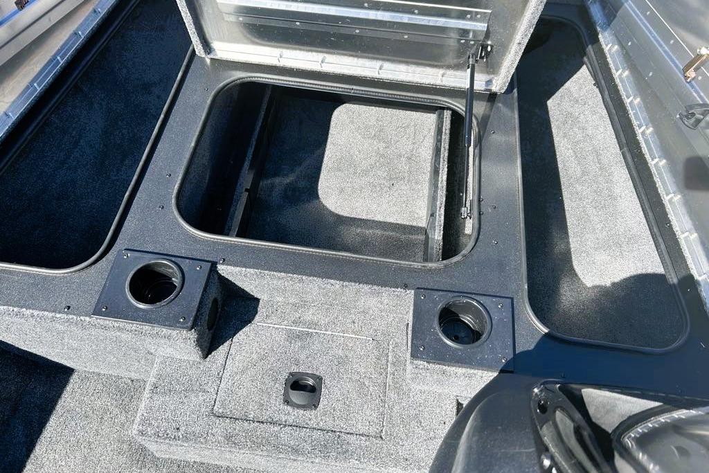 2026 Tracker Pro Team 175 boat interior with storage compartments and cup holders.
