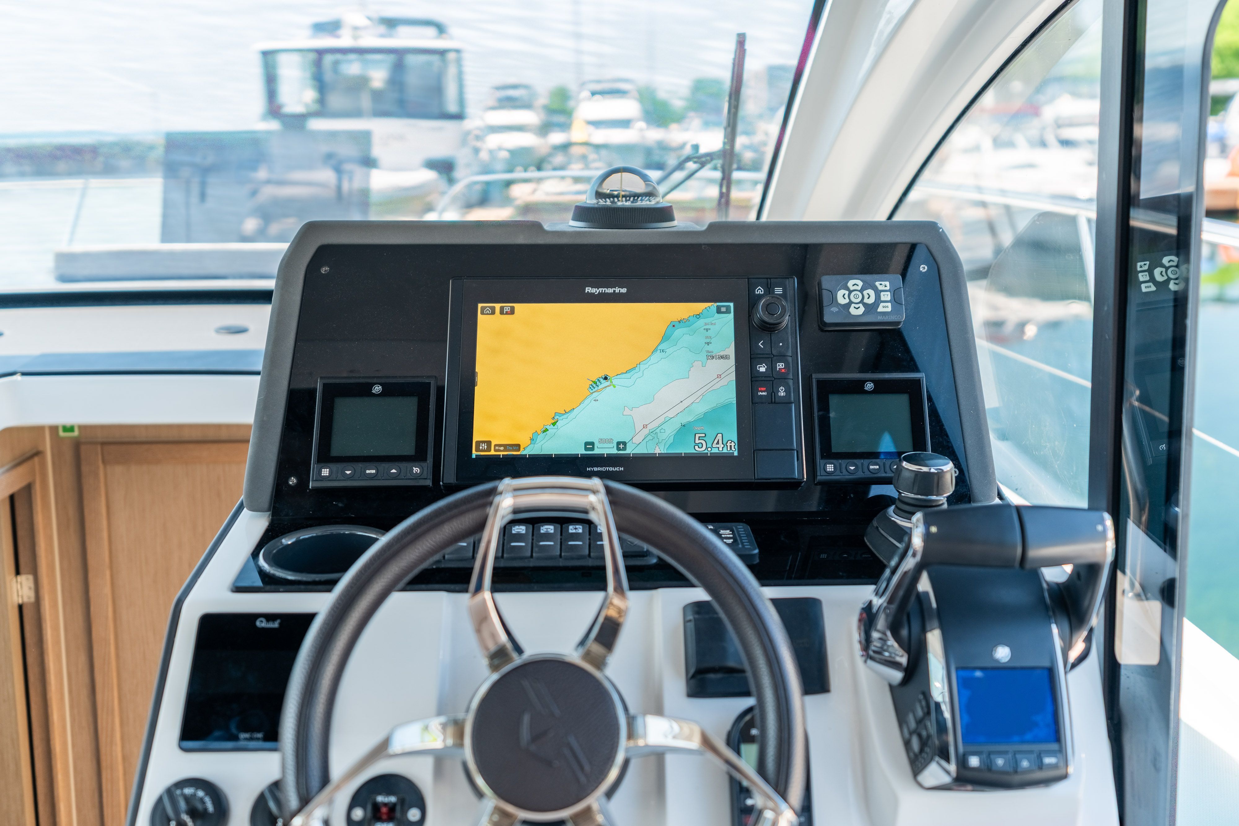 Helm of the Sealine C335V with modern navigation electronics.