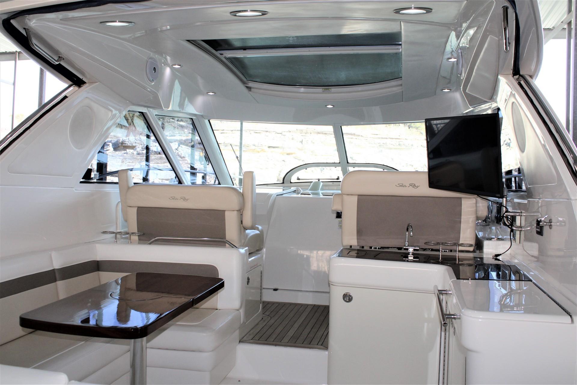 Interior of 2012 Sea Ray 450 Sundancer yacht with modern seating and entertainment area.