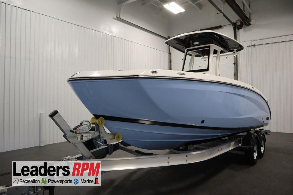 2026 Yamaha Boats 255 FSH Sport E in showroom, on trailer, side view.