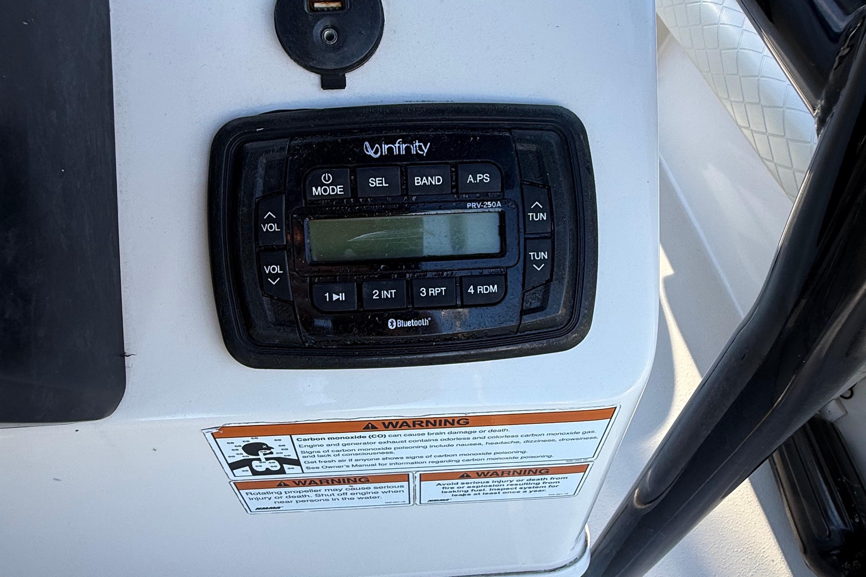 Infinity stereo system on 2021 Carolina Skiff 26 Ultra Elite boat dashboard.