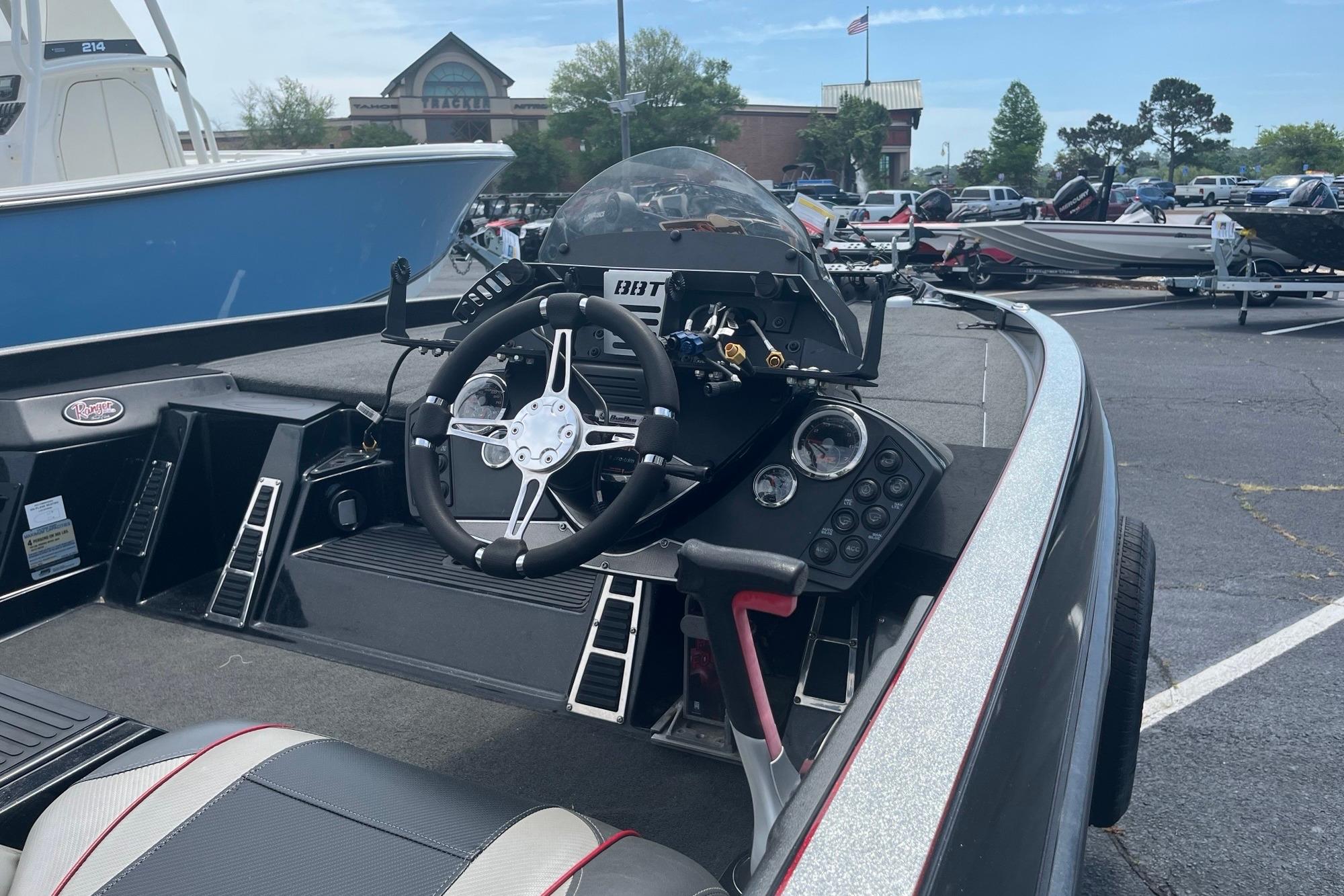 2017 Ranger Z518 Cup-Equipped boat interior with steering wheel and dashboard controls.