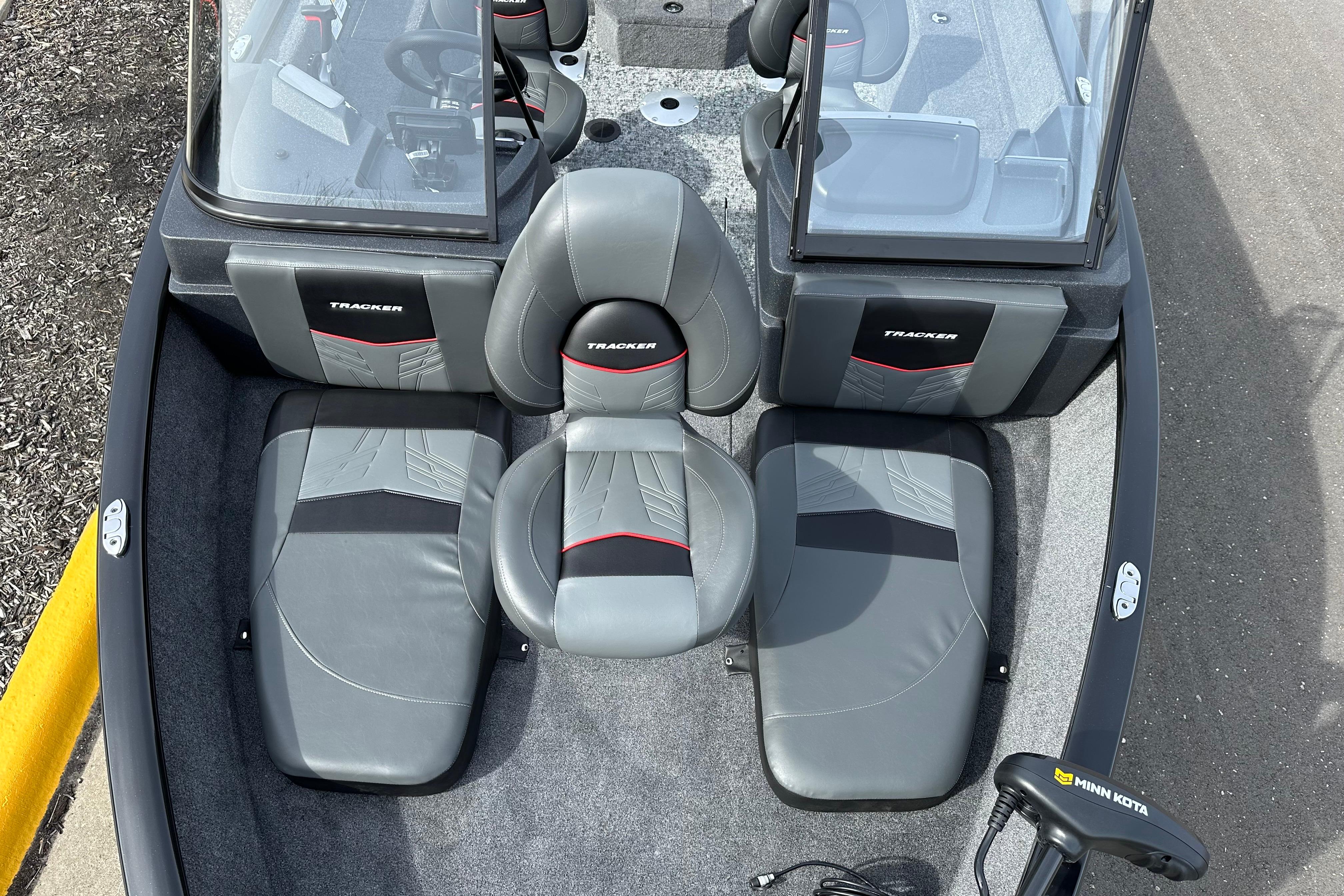 2026 Tracker Pro Guide V-175 Combo boat interior with gray seating and Minn Kota trolling motor.