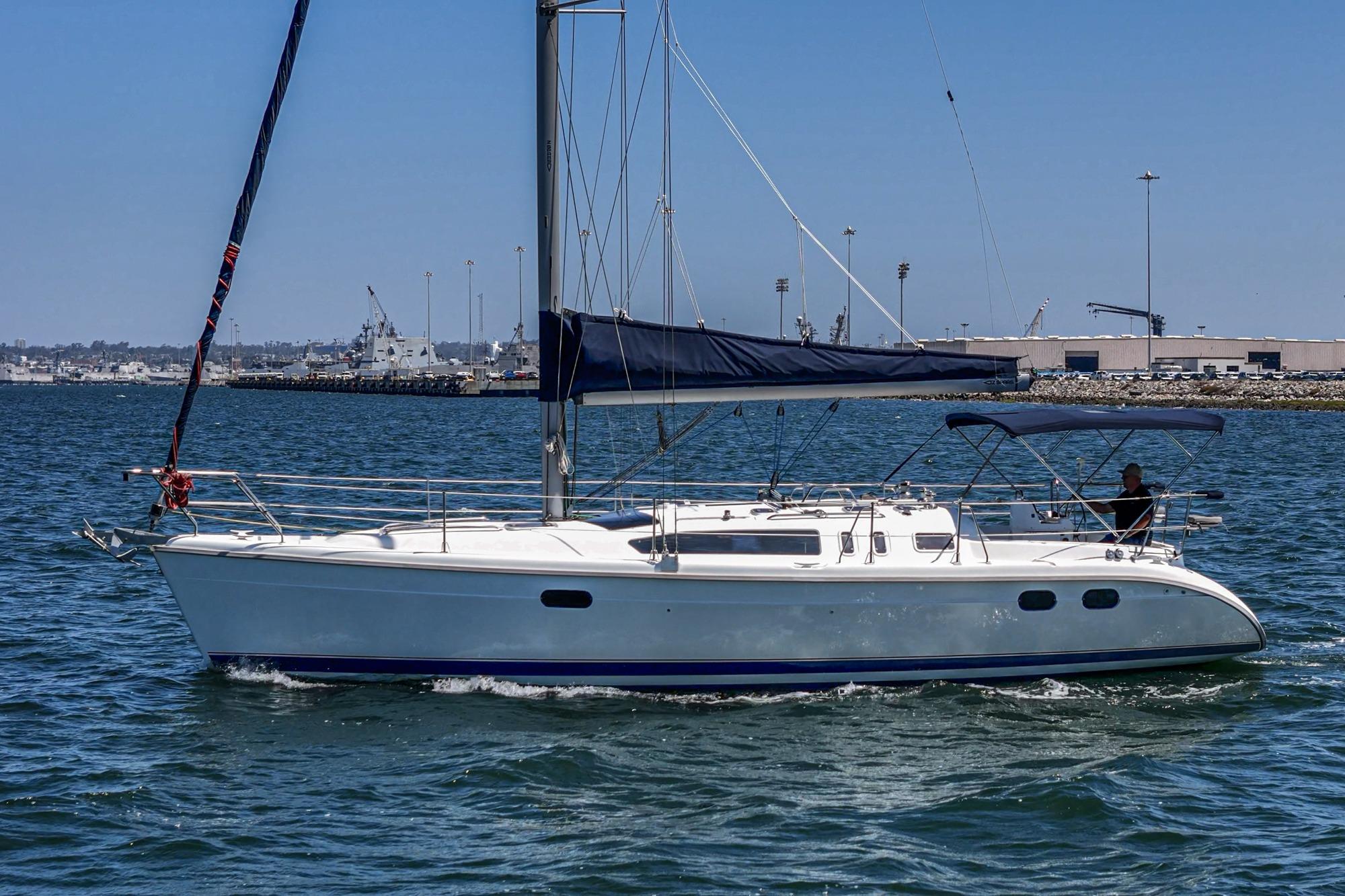 Sailboat Hunter 376, 1996 model, cruising on calm waters under clear blue skies.