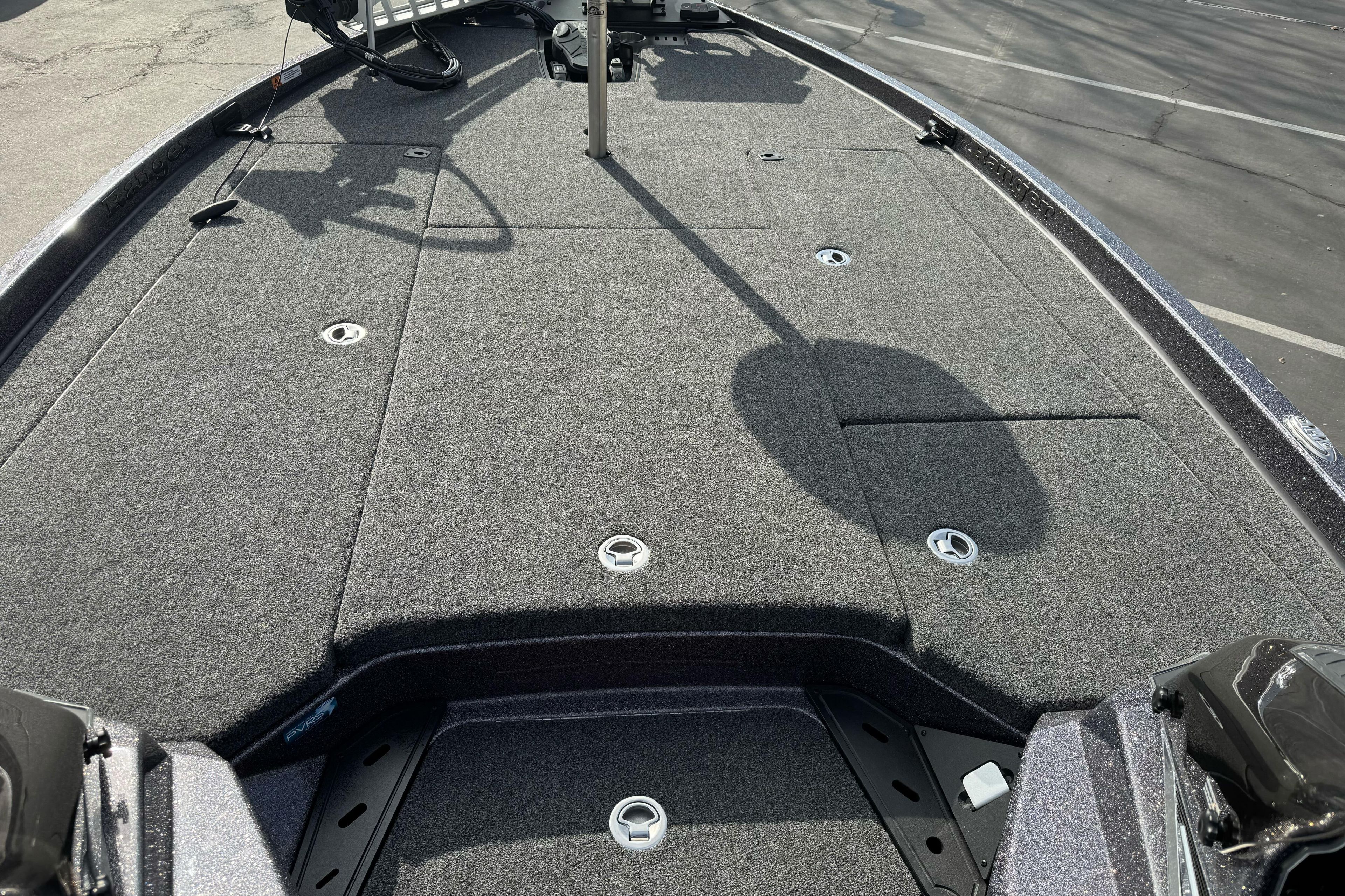 2025 Ranger Z521 boat deck with gray carpet and storage compartments.