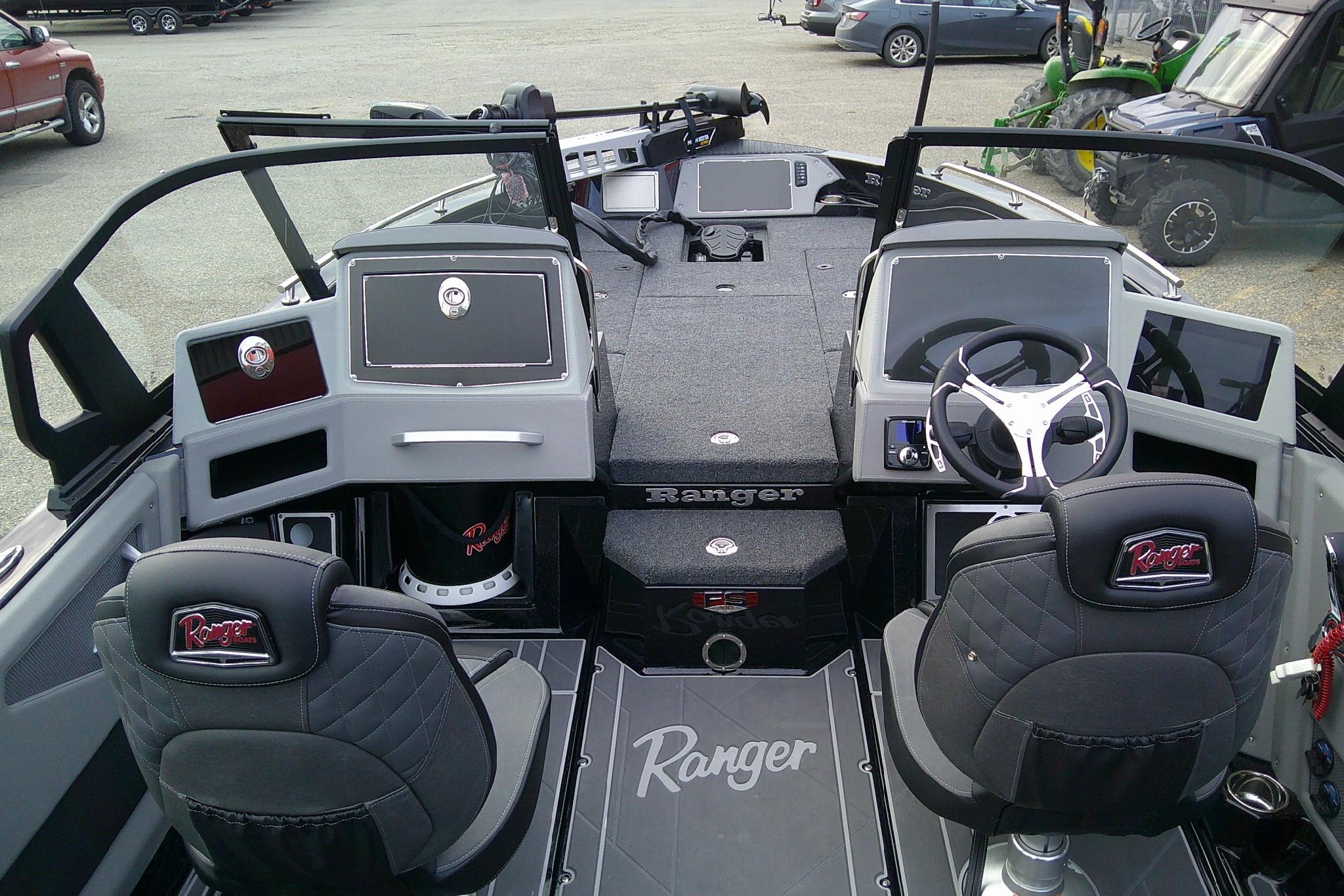 2026 Ranger 620FS Pro boat interior with dual seats, steering wheel, and dashboard controls.