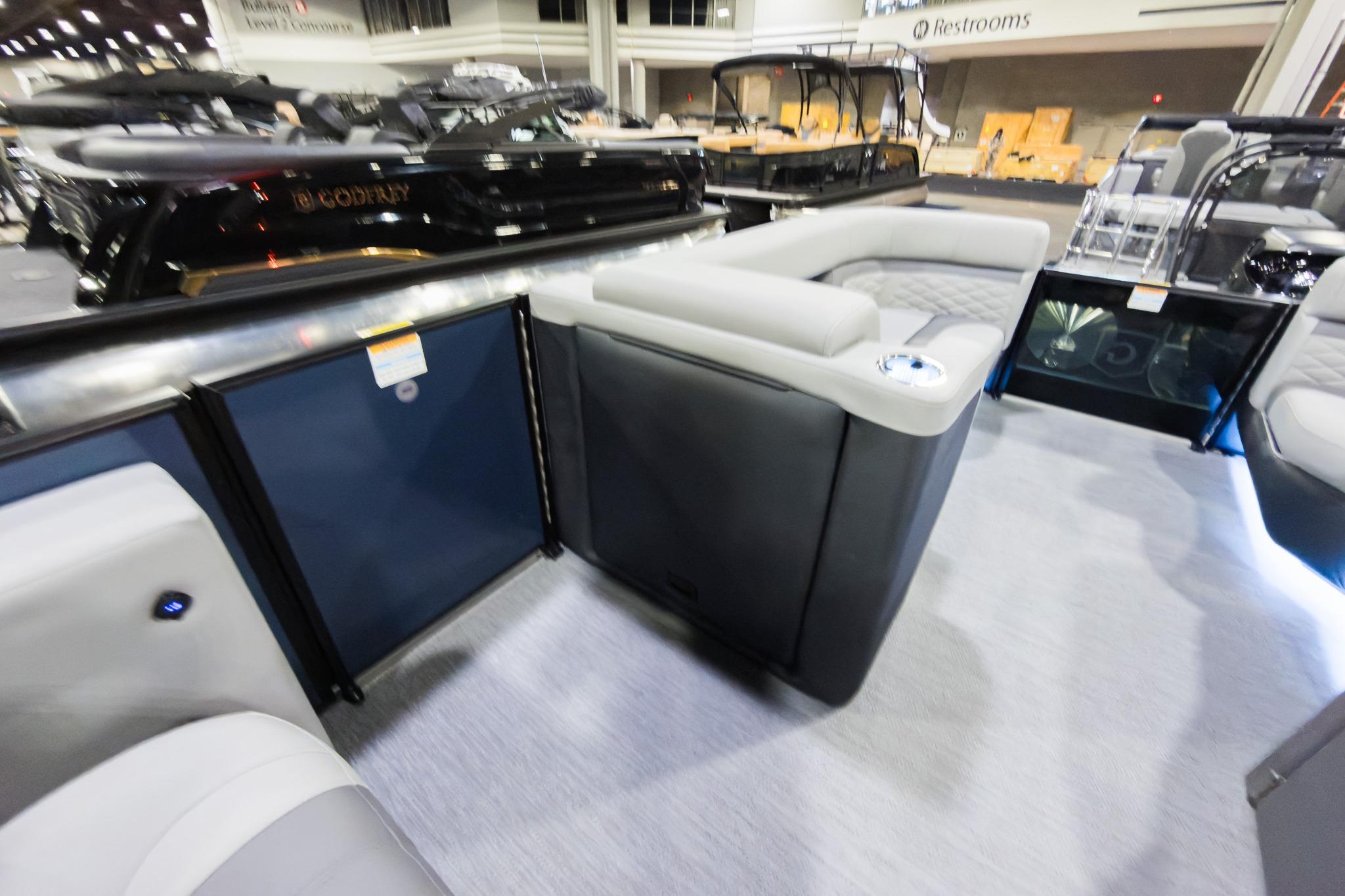 2026 Godfrey Monaco 235 boat interior with luxurious seating and modern design.