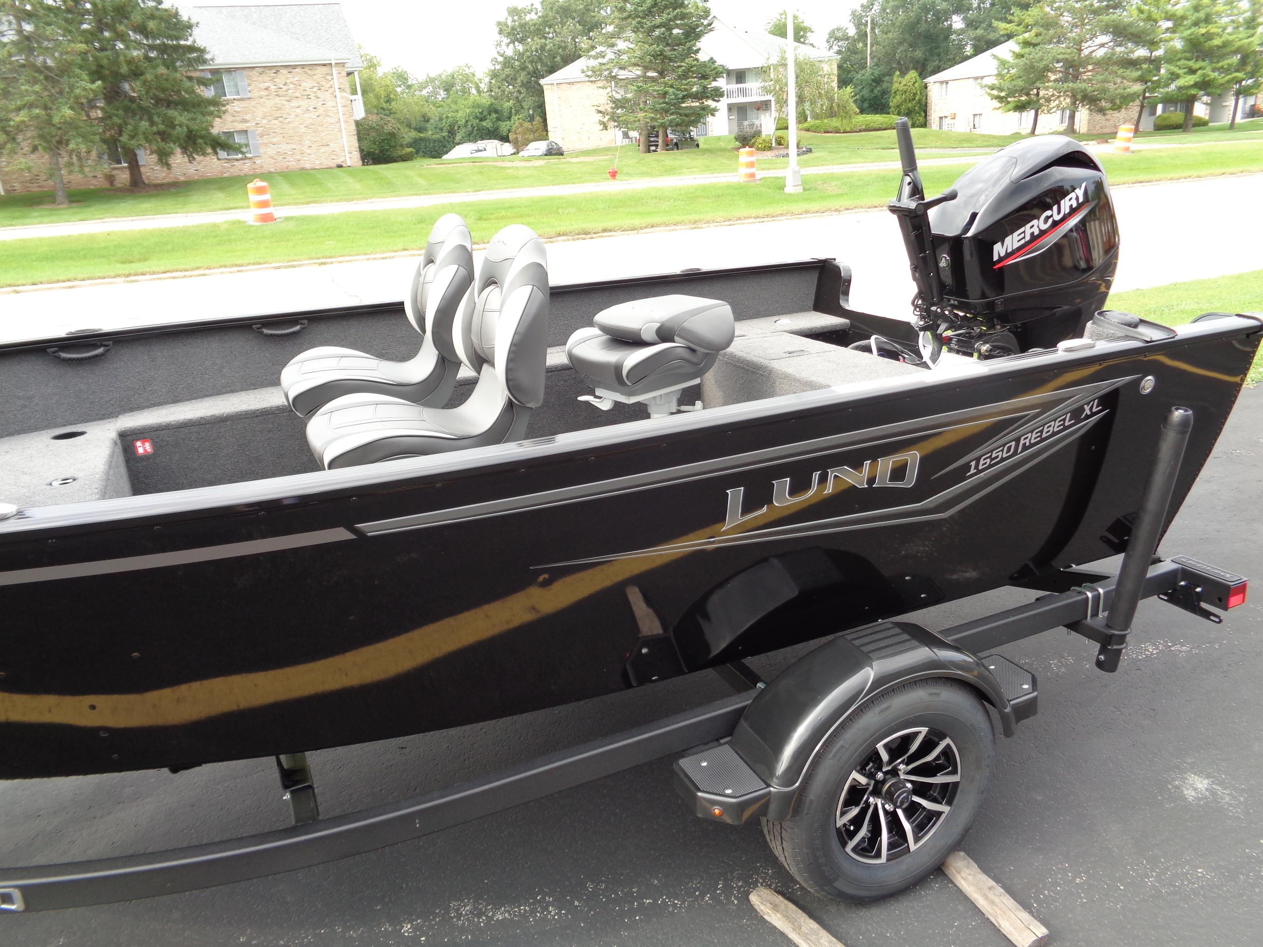 2025 Lund 1650 Rebel XL Tiller boat with Mercury engine on trailer.