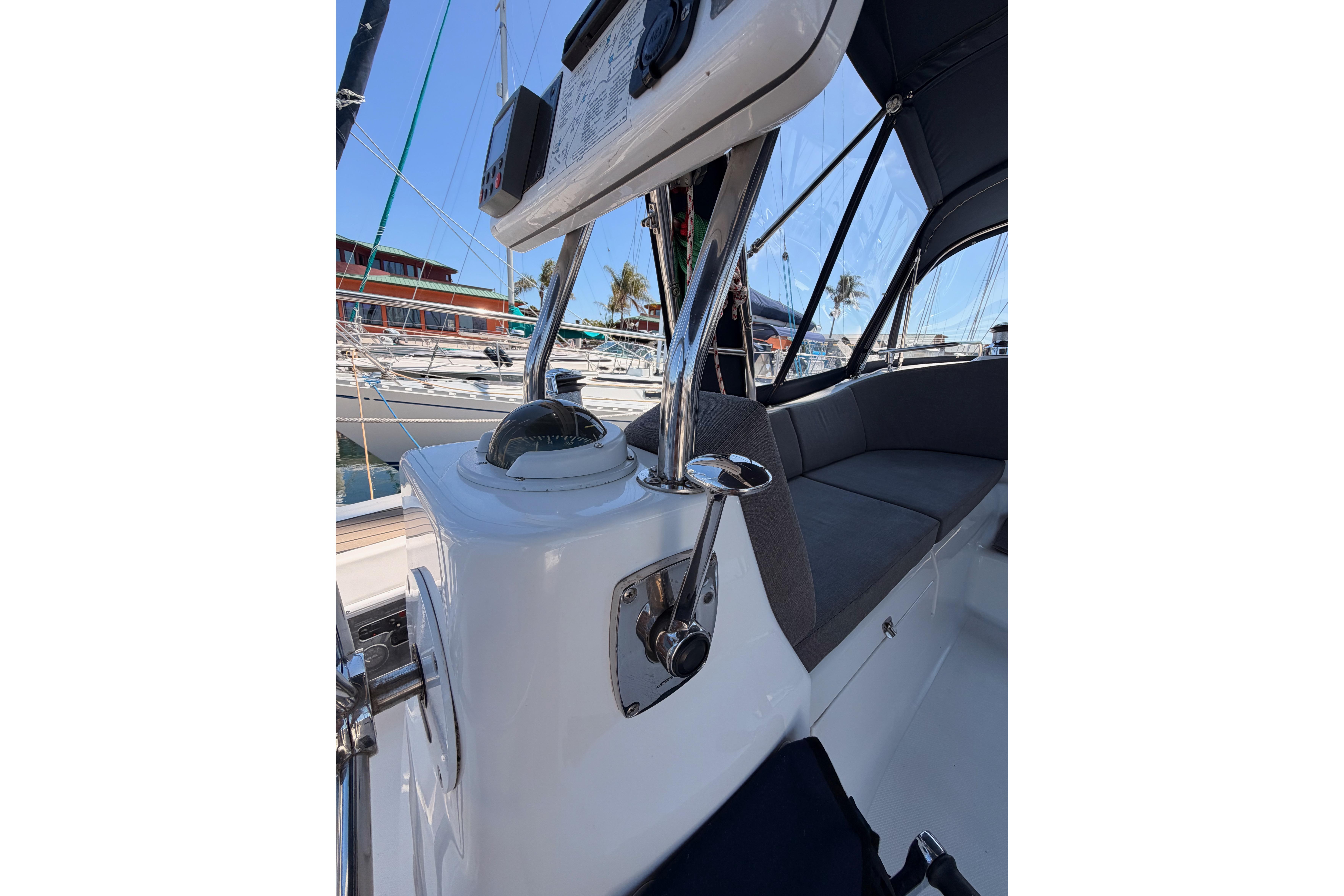 2008 Hunter 45 Deck Salon cockpit with navigation instruments and seating, docked at marina.
