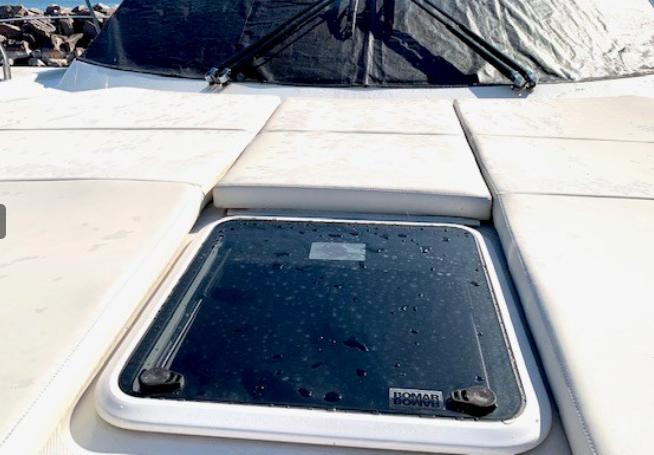 2016 Carver C37 yacht deck with Bomar hatch, wet surface.