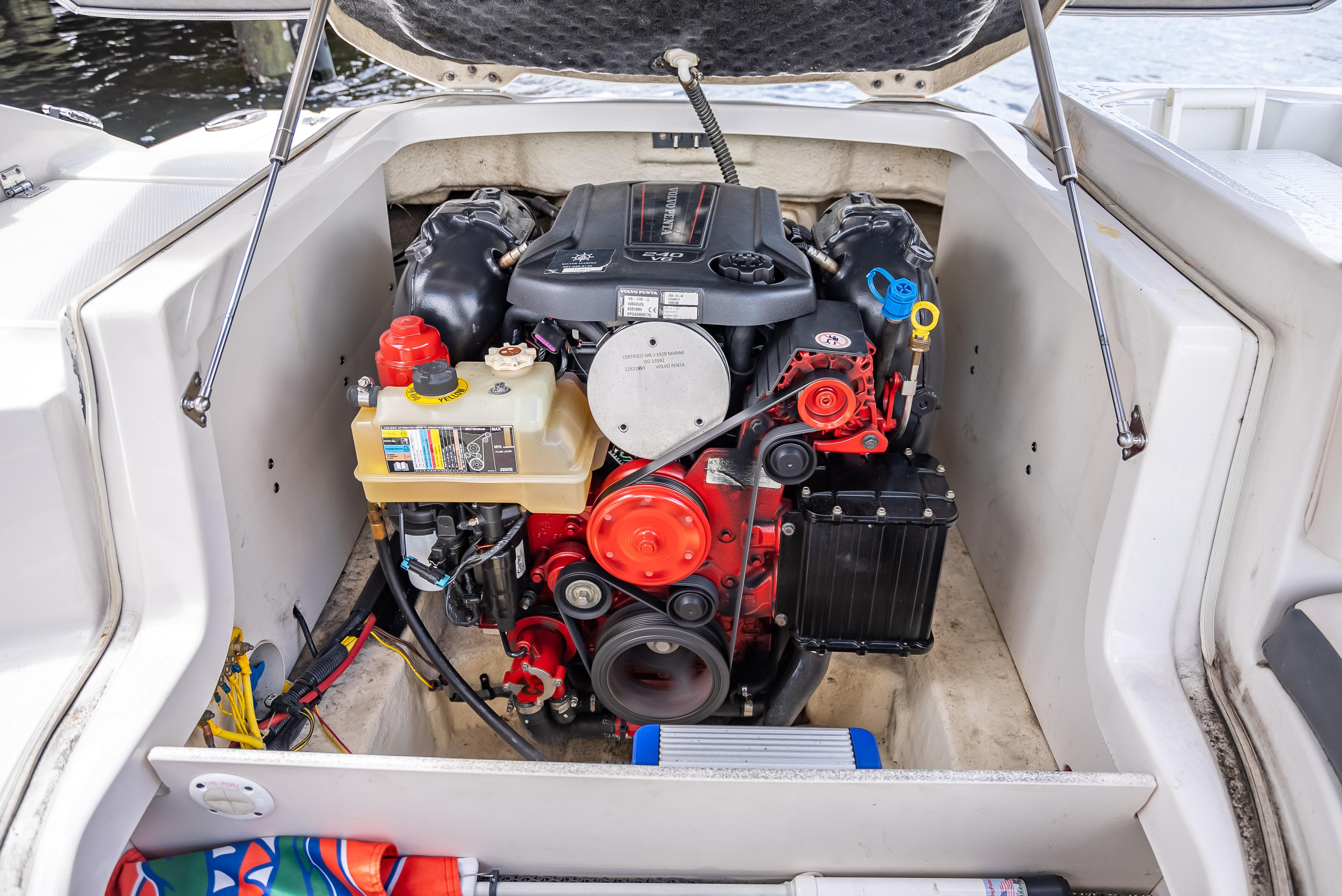 Engine compartment of a 2017 Chaparral 227 SSX boat, showcasing detailed components.