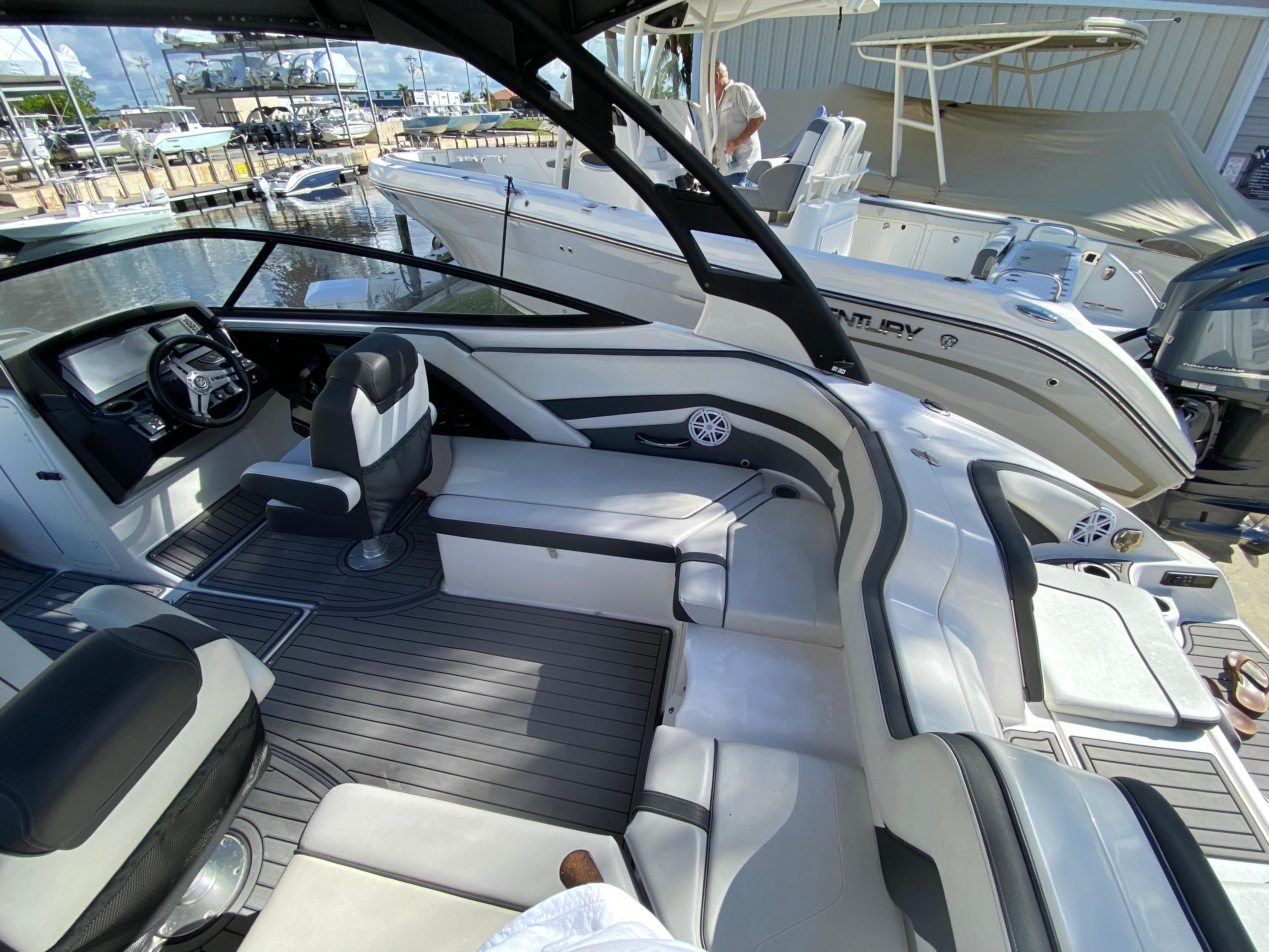 2018 Yamaha Boats 242 Limited S interior with sleek seating and modern dashboard.