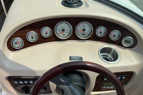 Dashboard of a 2006 Chaparral 220 SSi boat with gauges and controls.