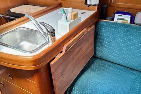 Beneteau Oceanis 311 yacht interior with sink and seating, 2000 model.