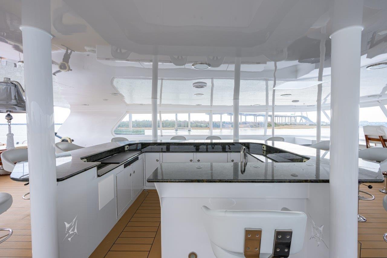 Luxurious 2011 C & G Boatworks Explorer yacht interior with sleek bar and seating area.