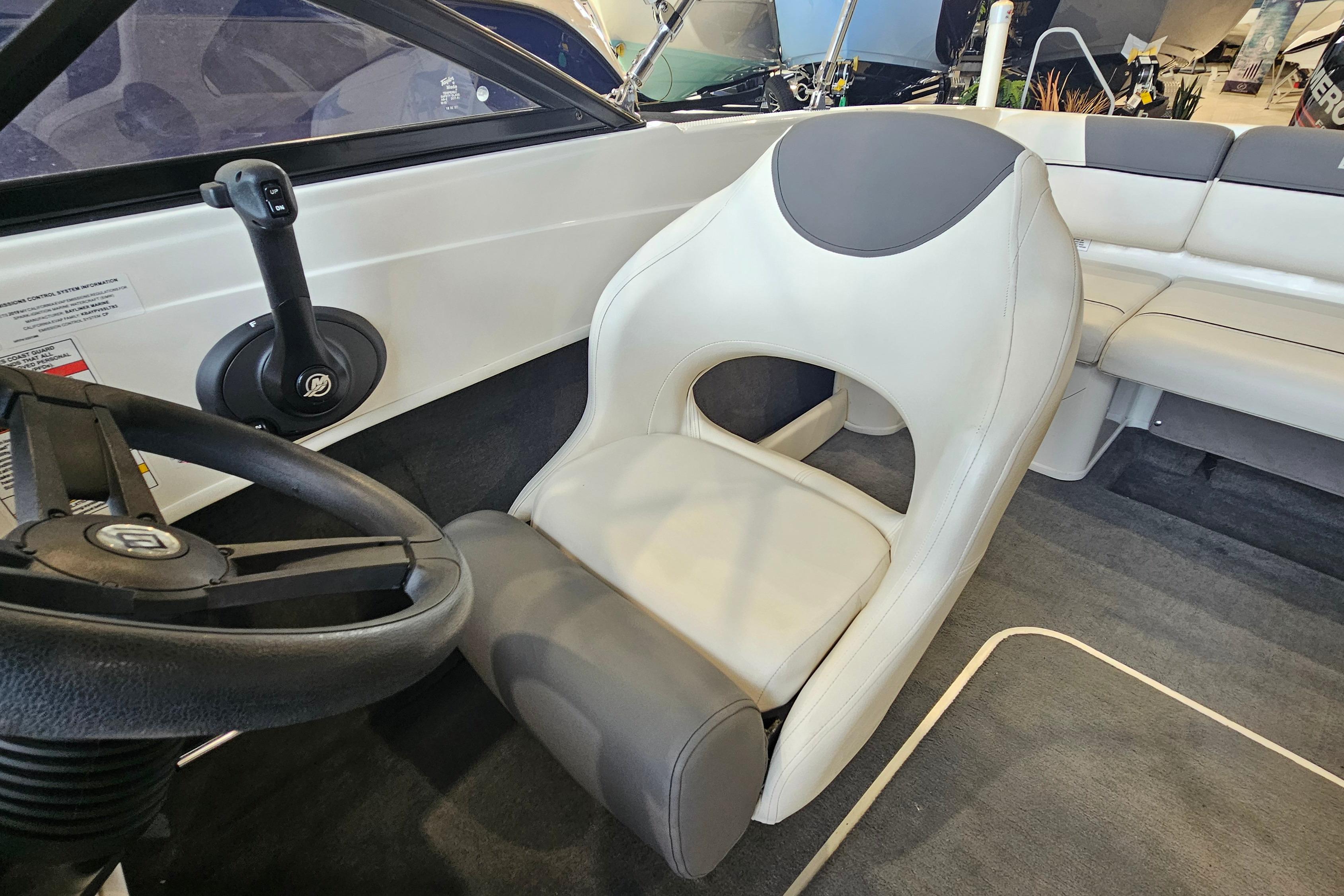 2019 Bayliner 170 Bowrider interior with steering wheel and seating.